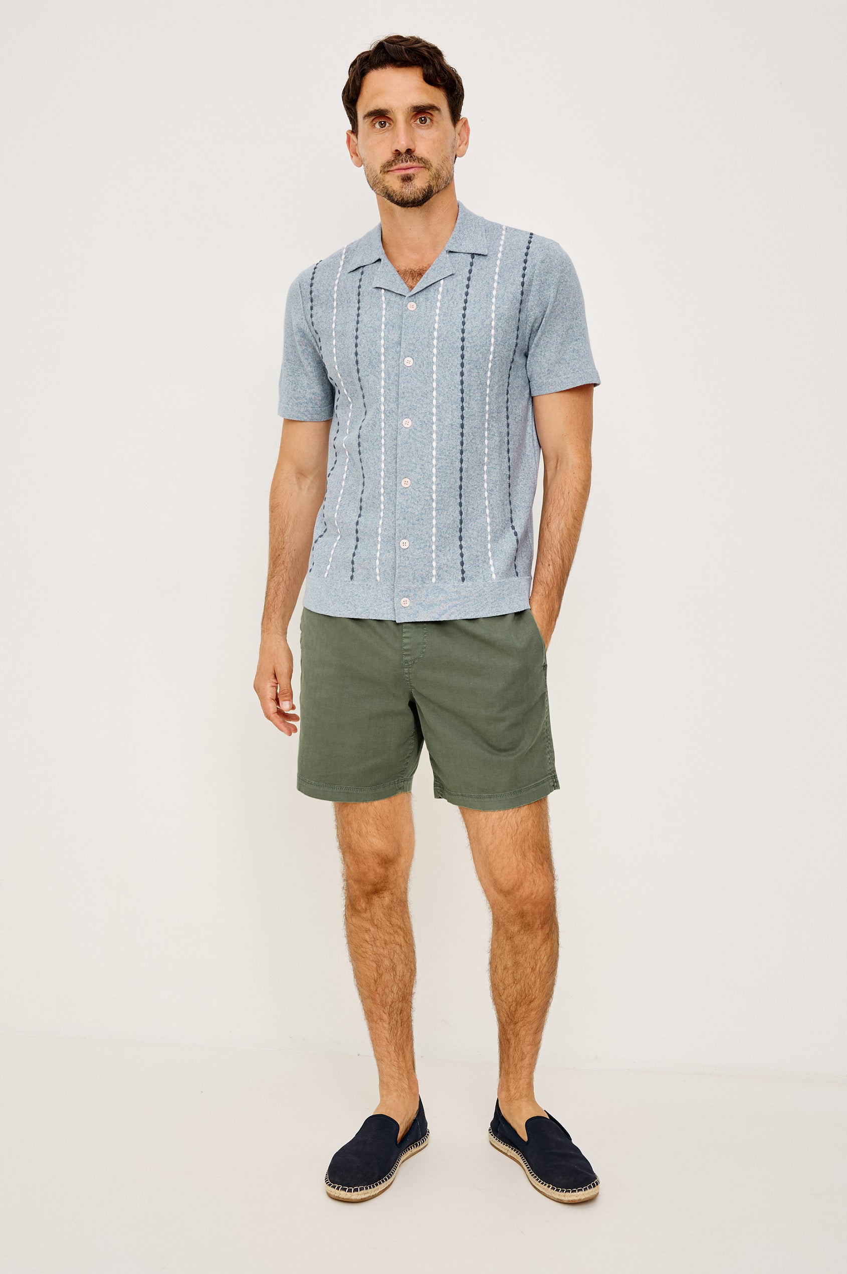 Richie Polo Shirt in Cotton Blend Knit With Collar, Front Buttons, Short Sleeves, and Classic Fit in Navy White Sky Colorway - Full Body Front View Featured on Model