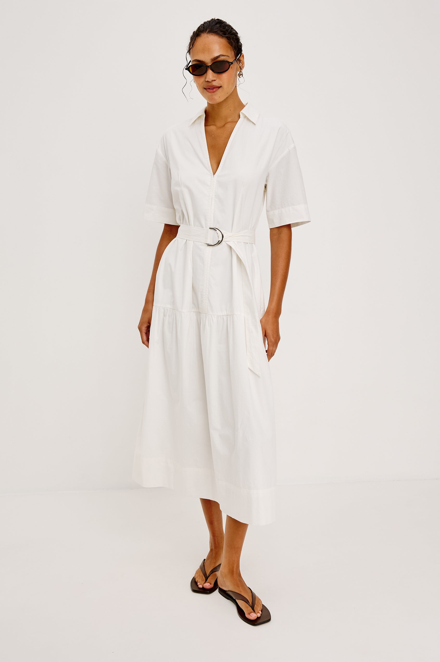 Richmond Midi Dress in Cotton With Collar Front Button Placket Side Pockets D-Ring Waist Belt Short Sleeves and Relaxed Fit in White Colorway - Full Body Front View Featured on Model