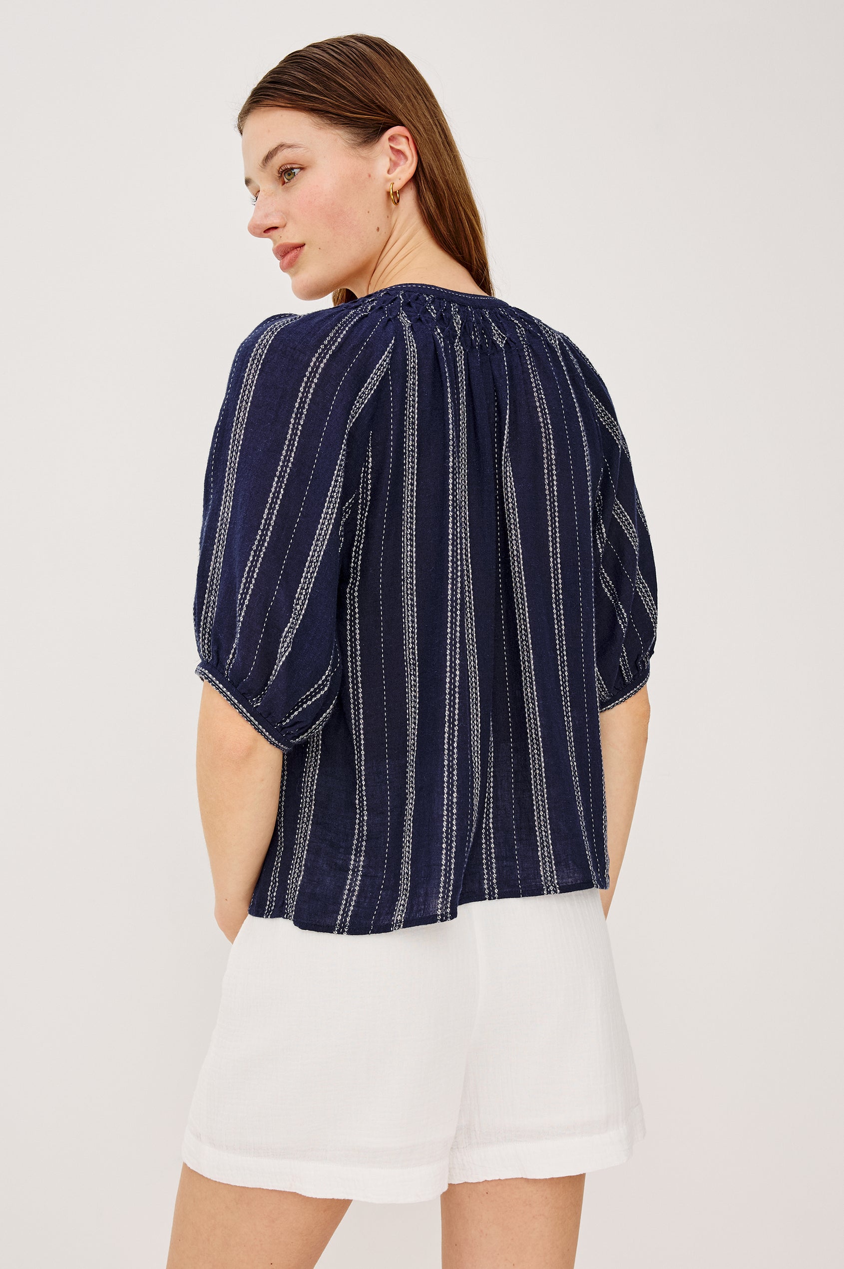 Rix Top in Linen With Scoop Neckline Relaxed Fit Smocked Yoke Elbow-Length Raglan Sleeves and Front Buttons in Marina Stripe Colorway - Upper Body Front View Featured on Model