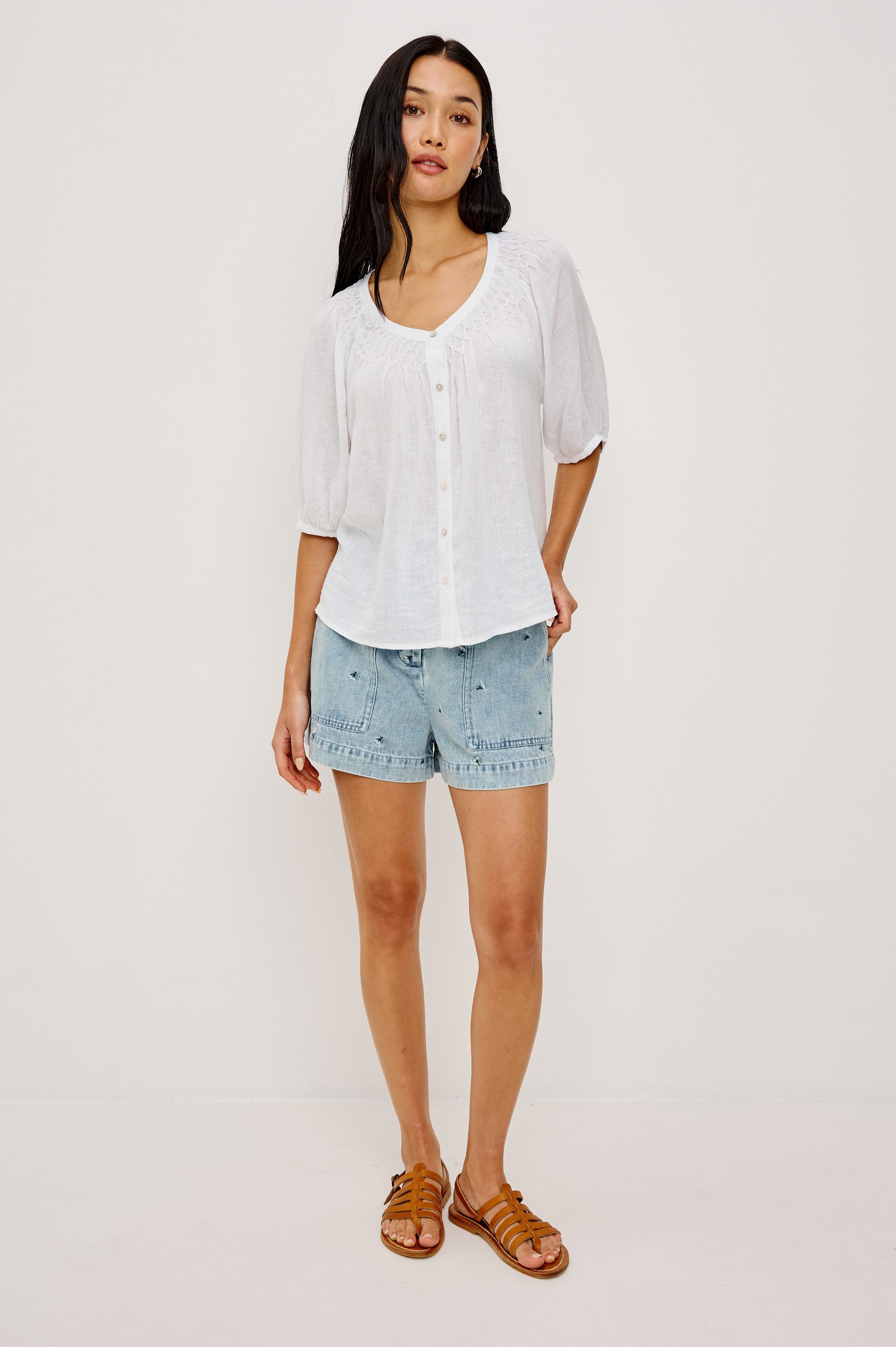 Rix Relaxed Button-Up Top in Linen With Scoop Neckline, Smocked Yoke, and Elbow Length Raglan Sleeves in White Colorway - Full Body Front View Featured on Model