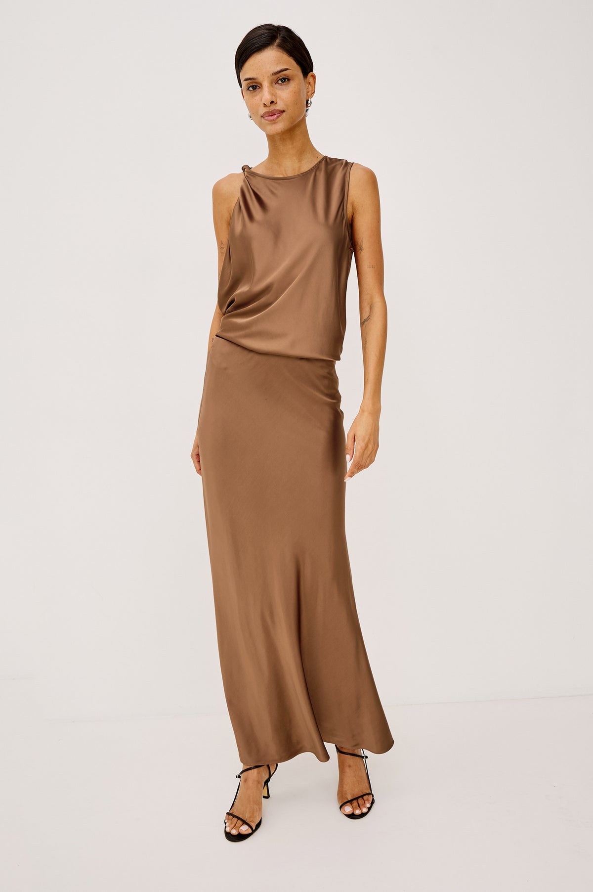 Robin Sleeveless Tank Shirt in Satin With Round Neck, Twisted Shoulder Strap, and Relaxed Fit in Cinnamon Colorway - Full Body Front View Featured on Model