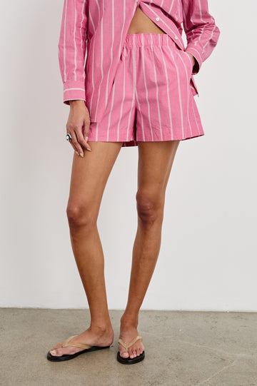 Rocky mid rise, loose fitting cotton short with elastic waistband in Hibiscus White Stripe colorway - front view on model