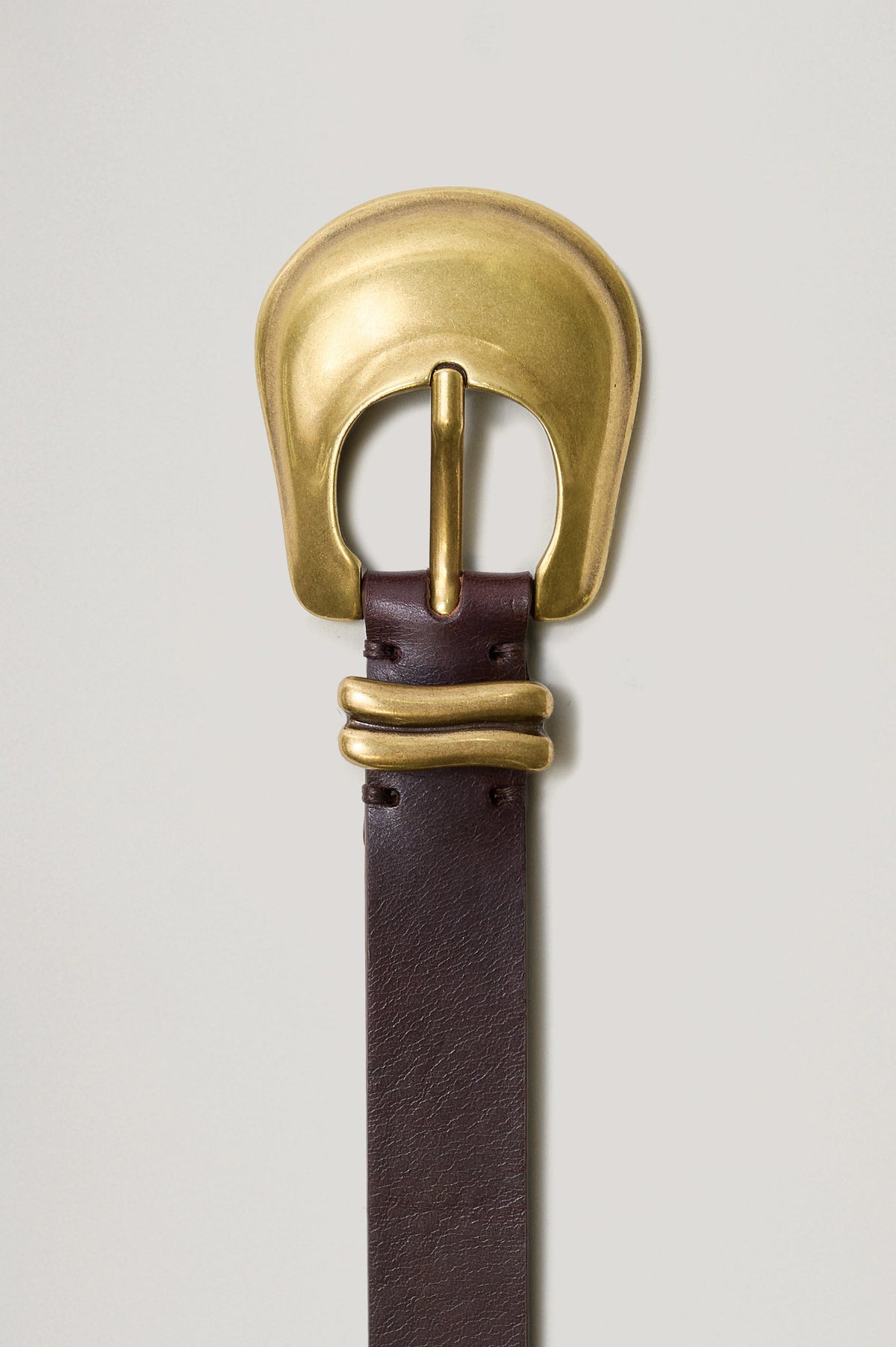 Rodeo Belt with a Brown Leather Belt with Belt Loop and a Chunky Gold-Toned Buckle in Brown Gold Colorway - Front View Featured on Model 