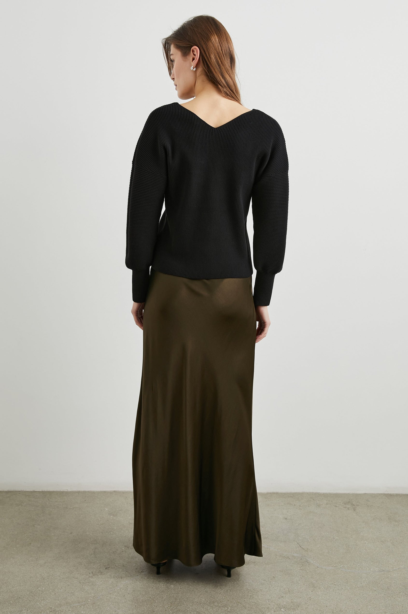 Romina Maxi Skirt in Dark Moss Colorway - Back Full Body View Featured on Model