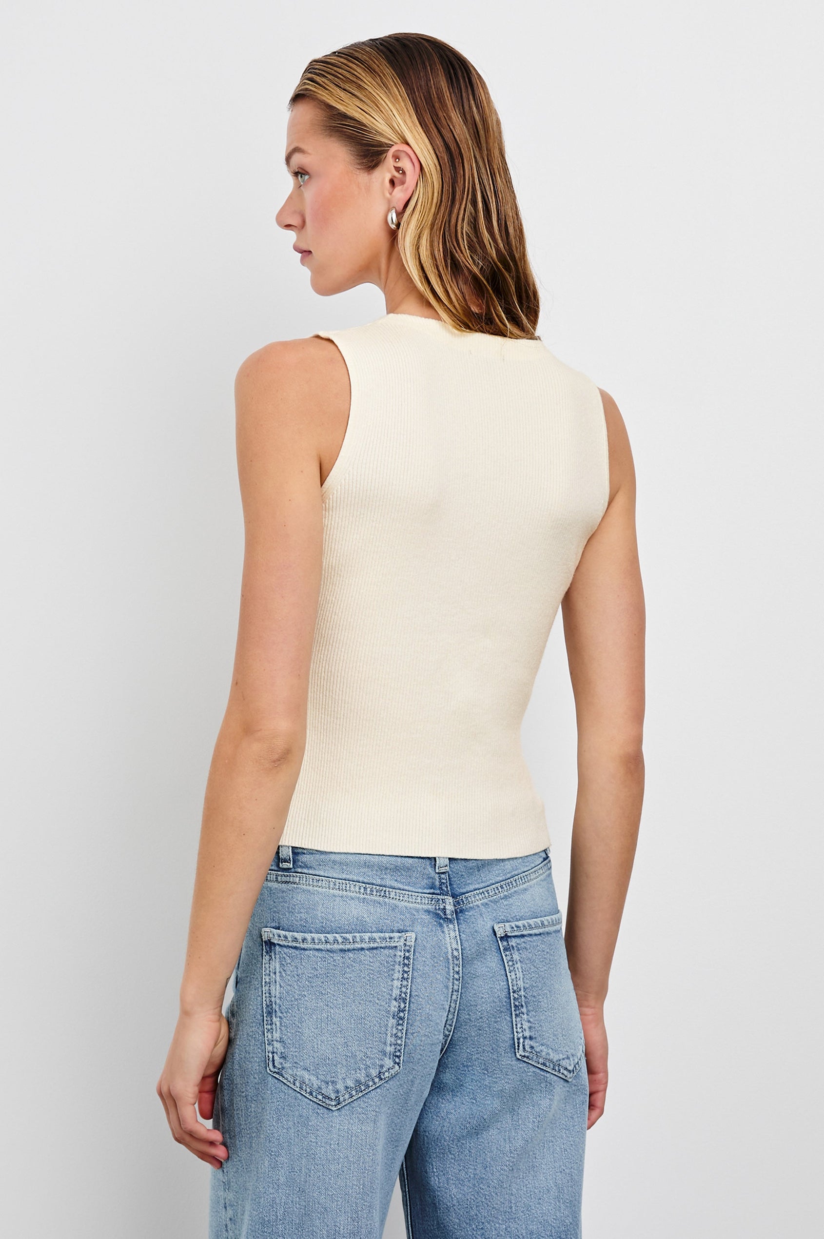 Rosa Ribbed Sleeveless Vest with a V Neckline and Buttons Down the Front in Ivory Colorway - Back View Featured on Model