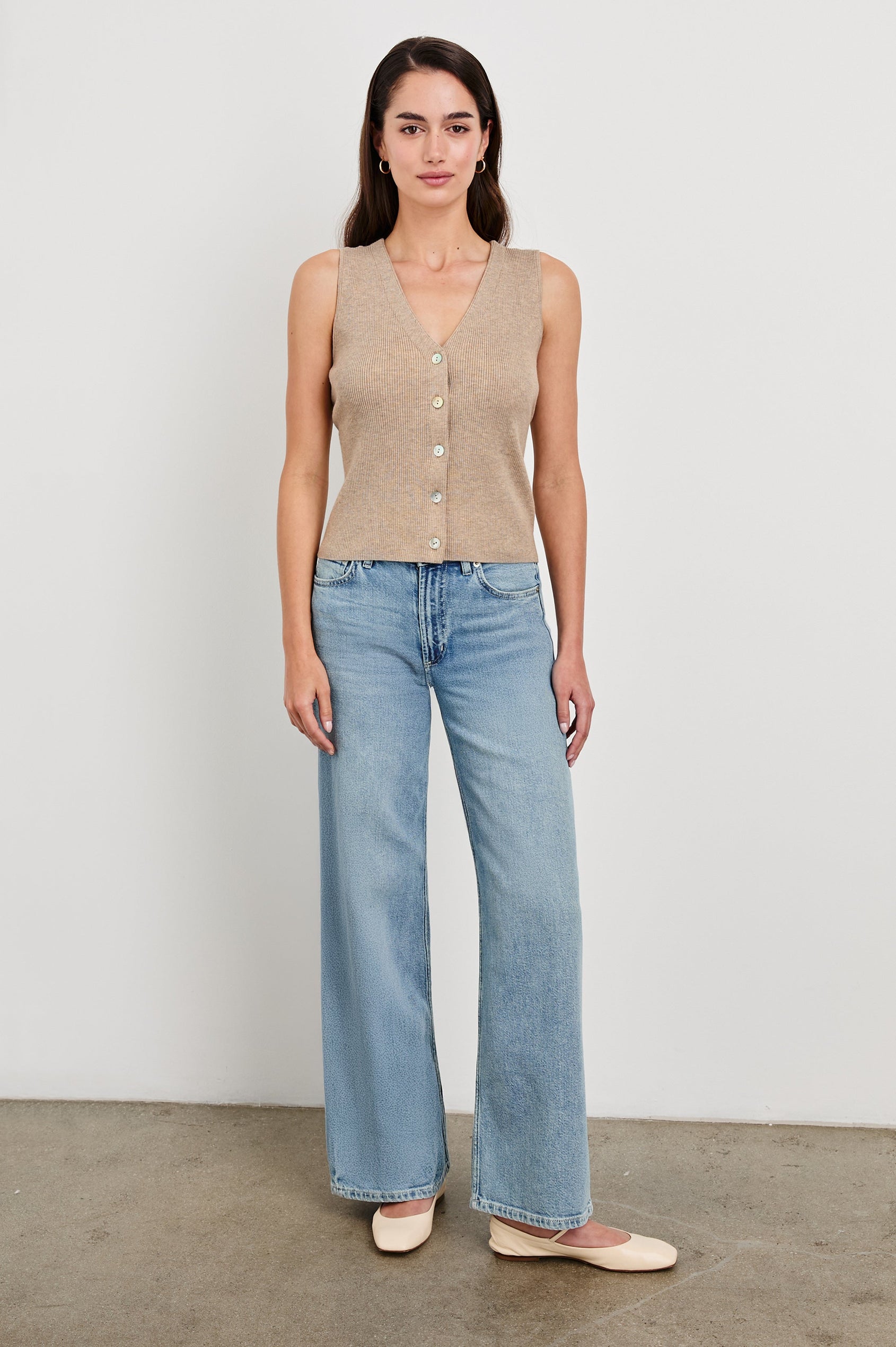 Rosa Ribbed Sleeveless Vest with a V Neckline and Buttons Down the Front in Oatmeal Colorway - Front Full Body View Featured on Model