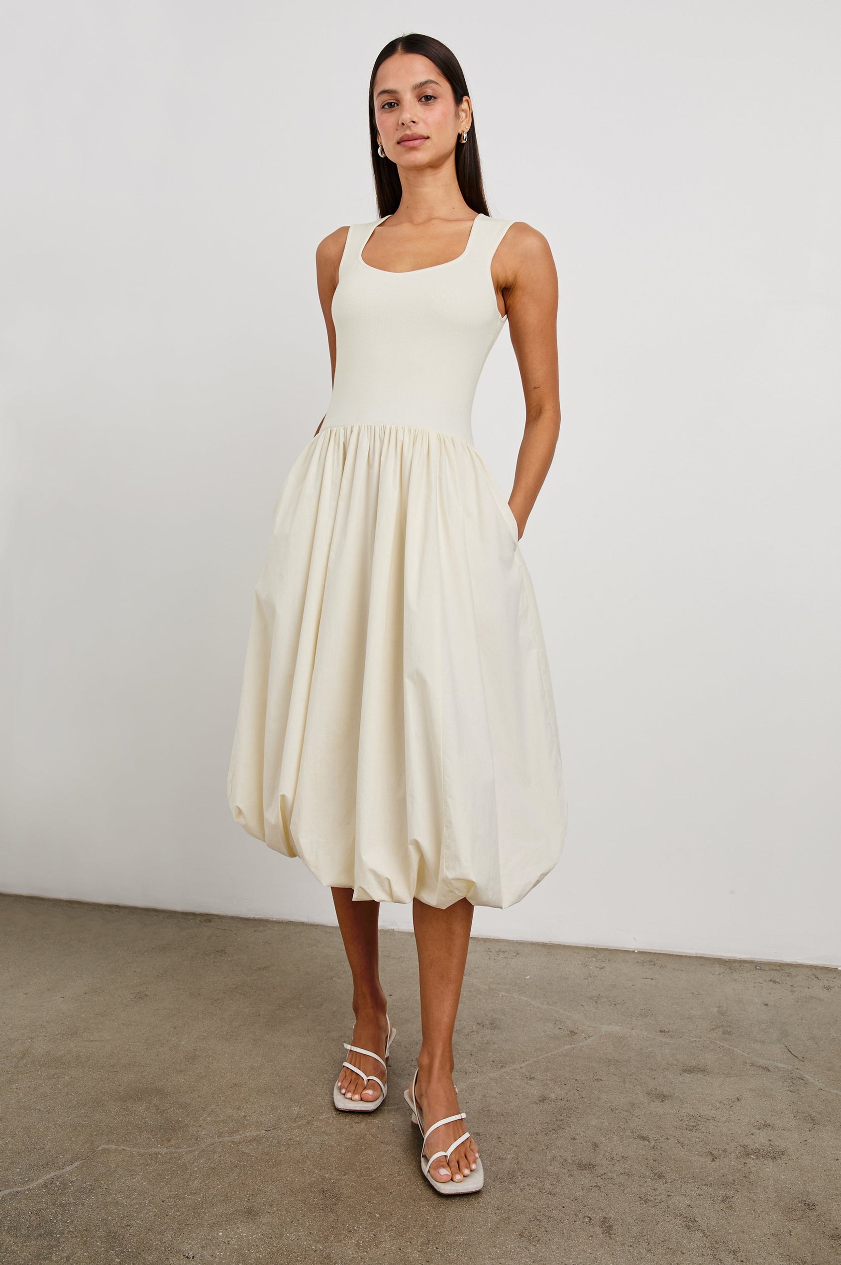 Rosalind tank midi dress with scoop neck, fitted bodice, and bubble skirt in Ivory - full body front view on model