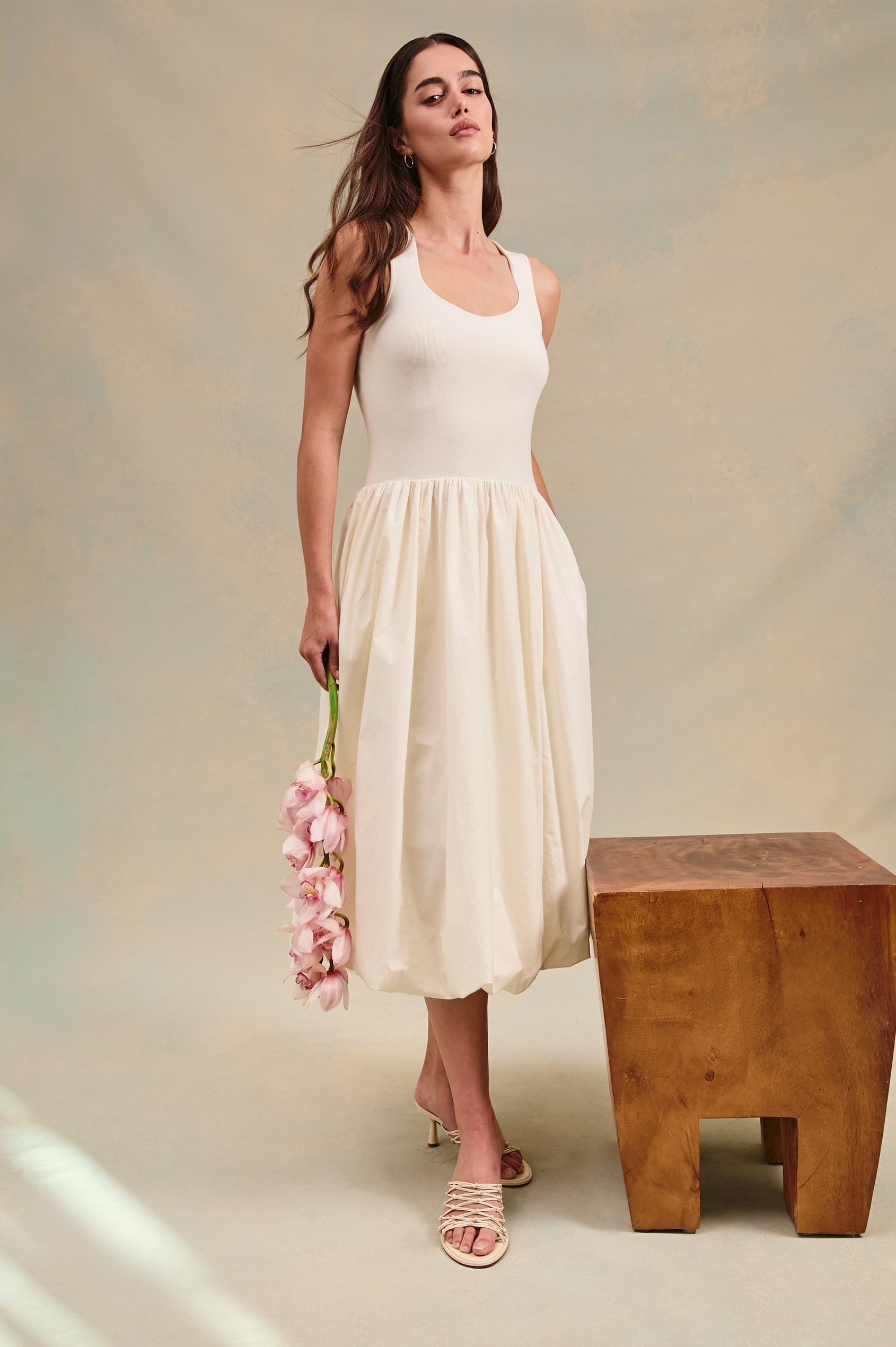 Rosalind tank midi dress with scoop neck, fitted bodice, and bubble skirt in Ivory - stylized full body view on model