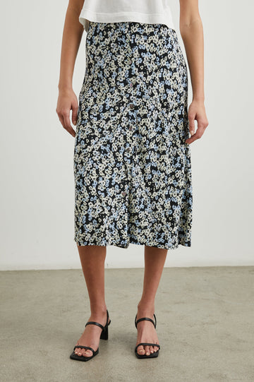 Rosetta Midi Skirt with Buttons Down the Front in Midnight Meadow Floral Colorway, blue and white flowers on Midnight - Front View Featured on Model 