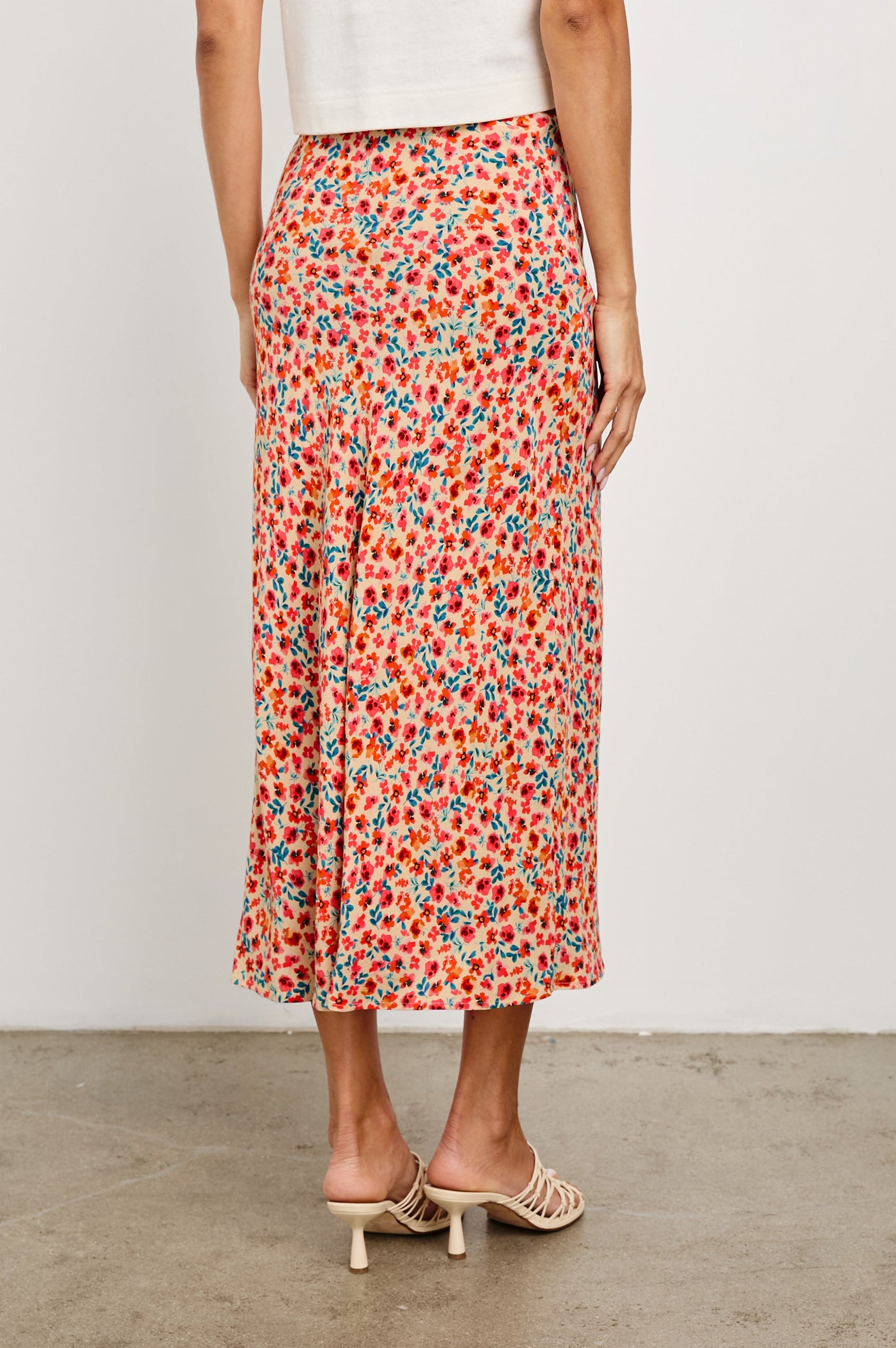 Rosetta Midi Skirt with White Buttons Down the Front in Red Posy Colorway, with Red Posies on Tan - Back View Featured on Model 