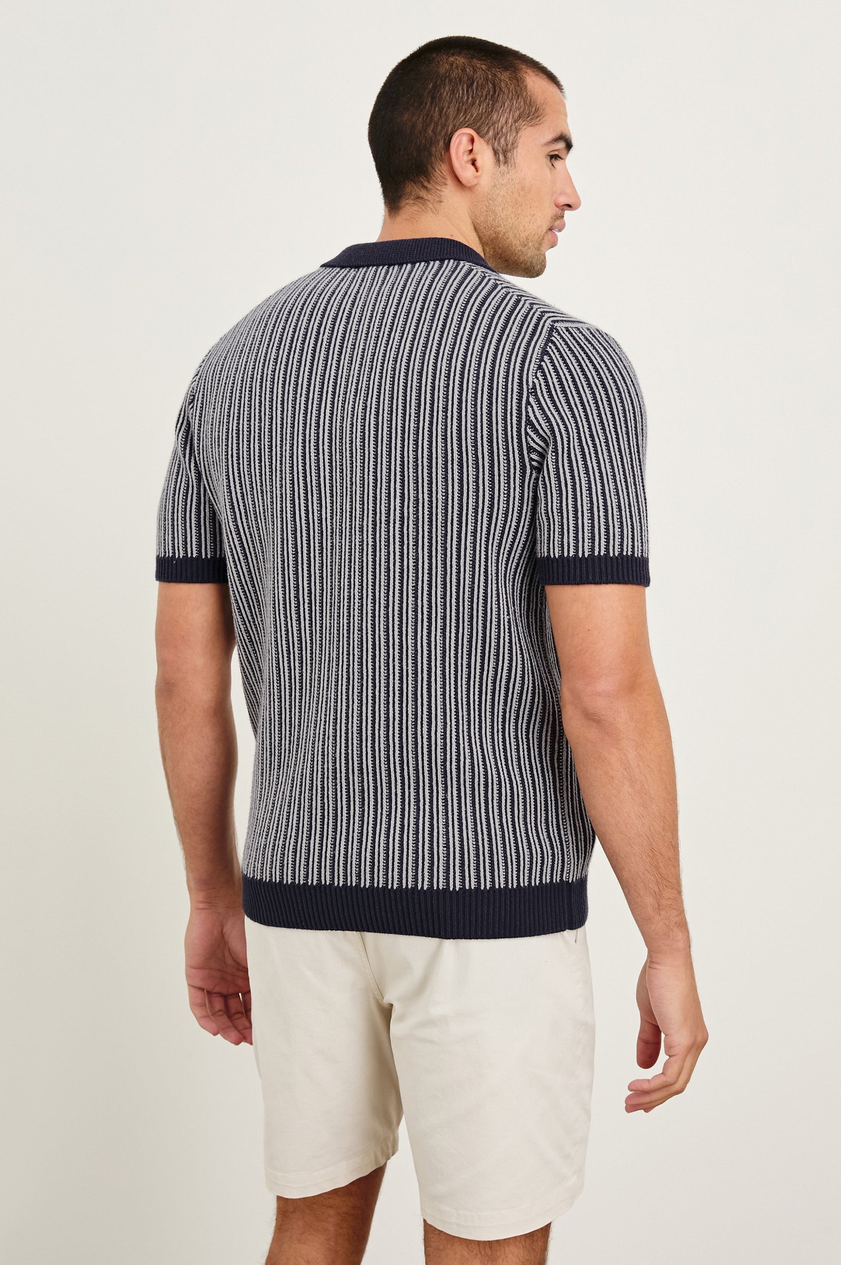 Royce ribbed knit short sleeve polo with three front buttons and a collar in Navy Grey - back view on model