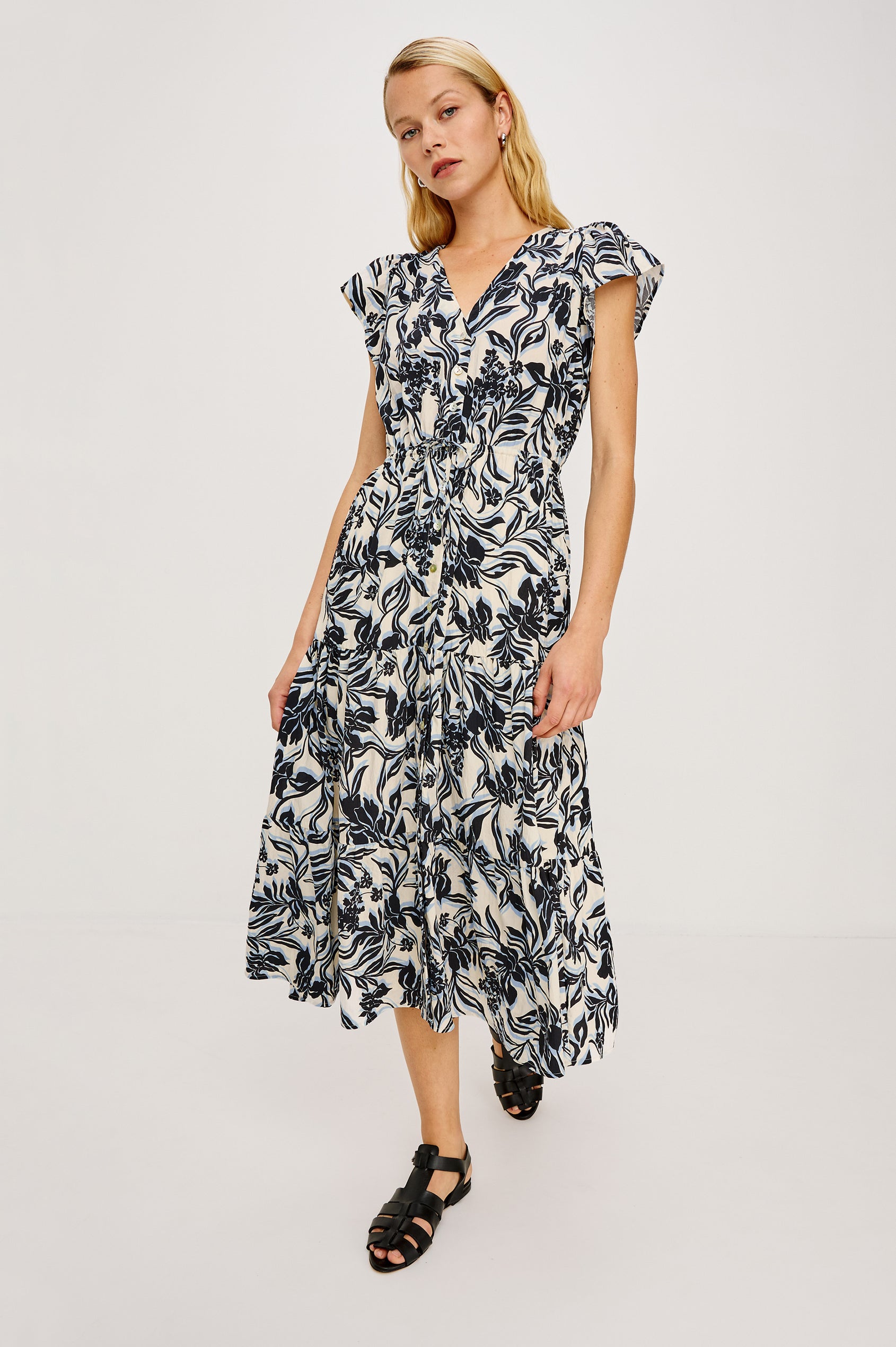 Roza Midi Dress in Cotton Poplin With V-Neckline Flutter Sleeves Front BUttons Adjustable Waist Ties and Tiered Lined Skirt in Zinya Colorway - Full Body Front View Featured on Model