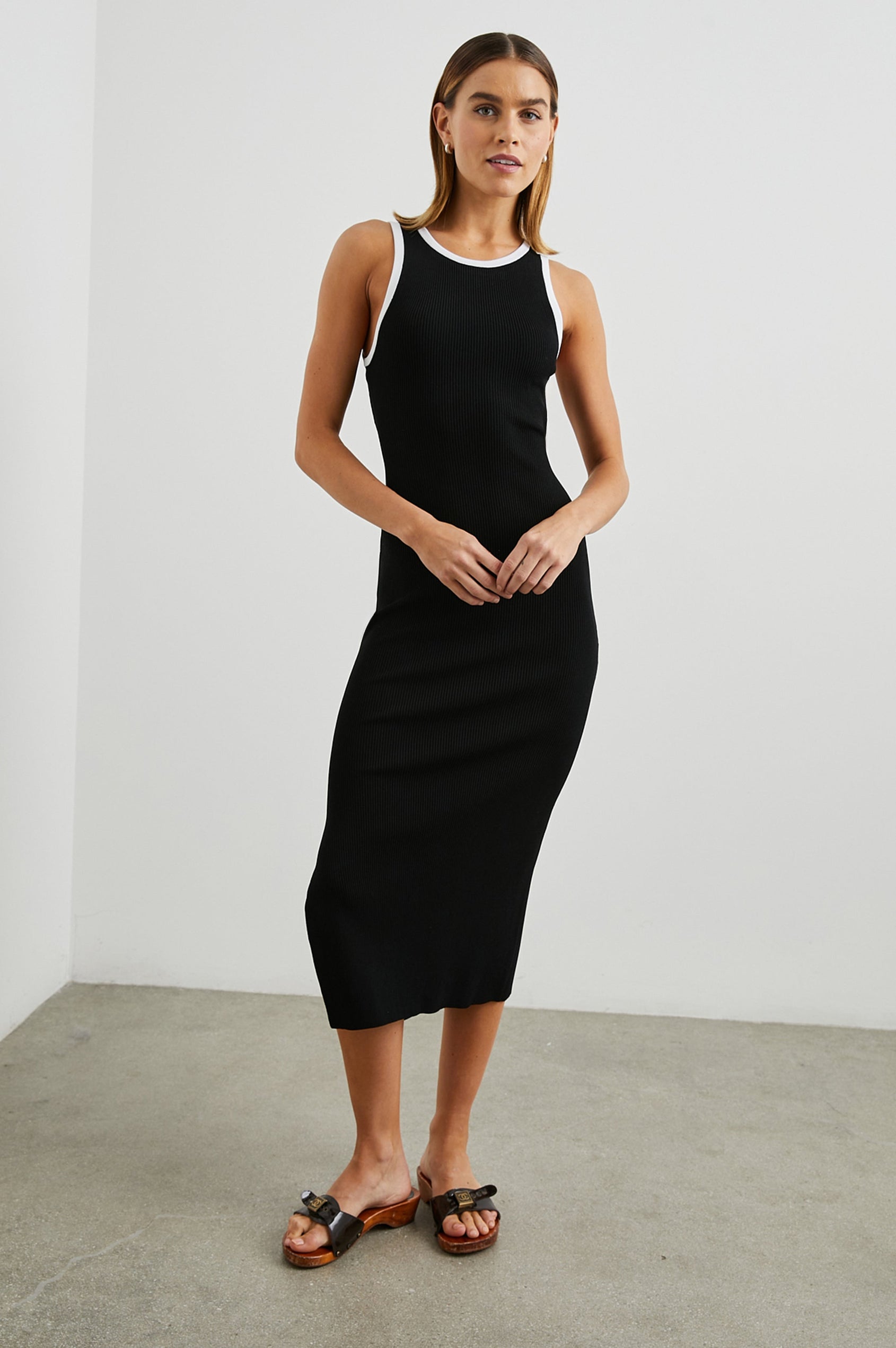 Rue Sleeveless Ribbed Midi Dress with a Shallow Scoop Neck, and a Lower Back Cutout in Black Colorway, Trimmed with White - Front Full Body View Featured on Model 