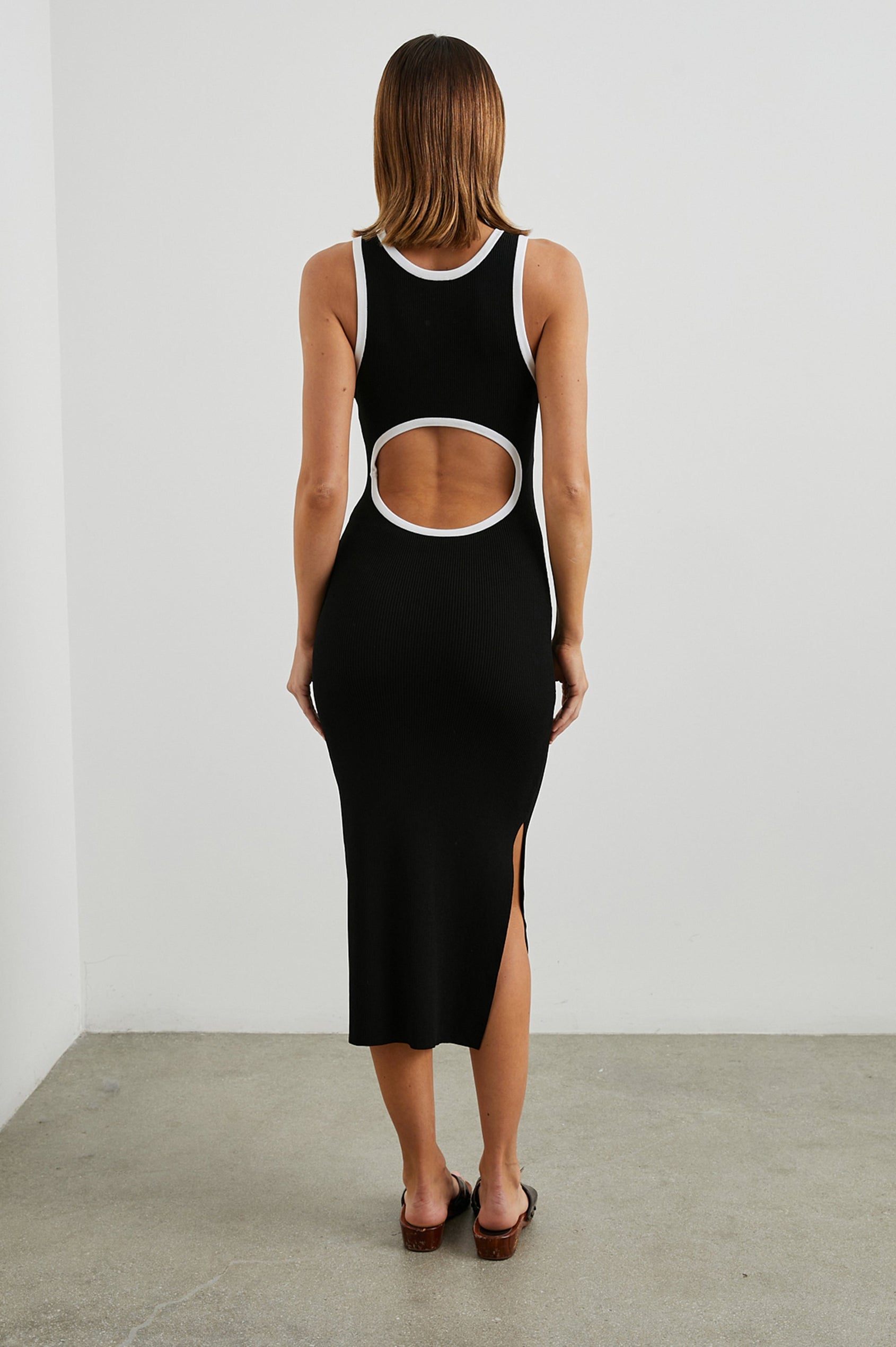 Rue Sleeveless Ribbed Midi Dress with a Shallow Scoop Neck, and a Lower Back Cutout in Black Colorway, Trimmed with White - Back Full Body View Featured on Model 