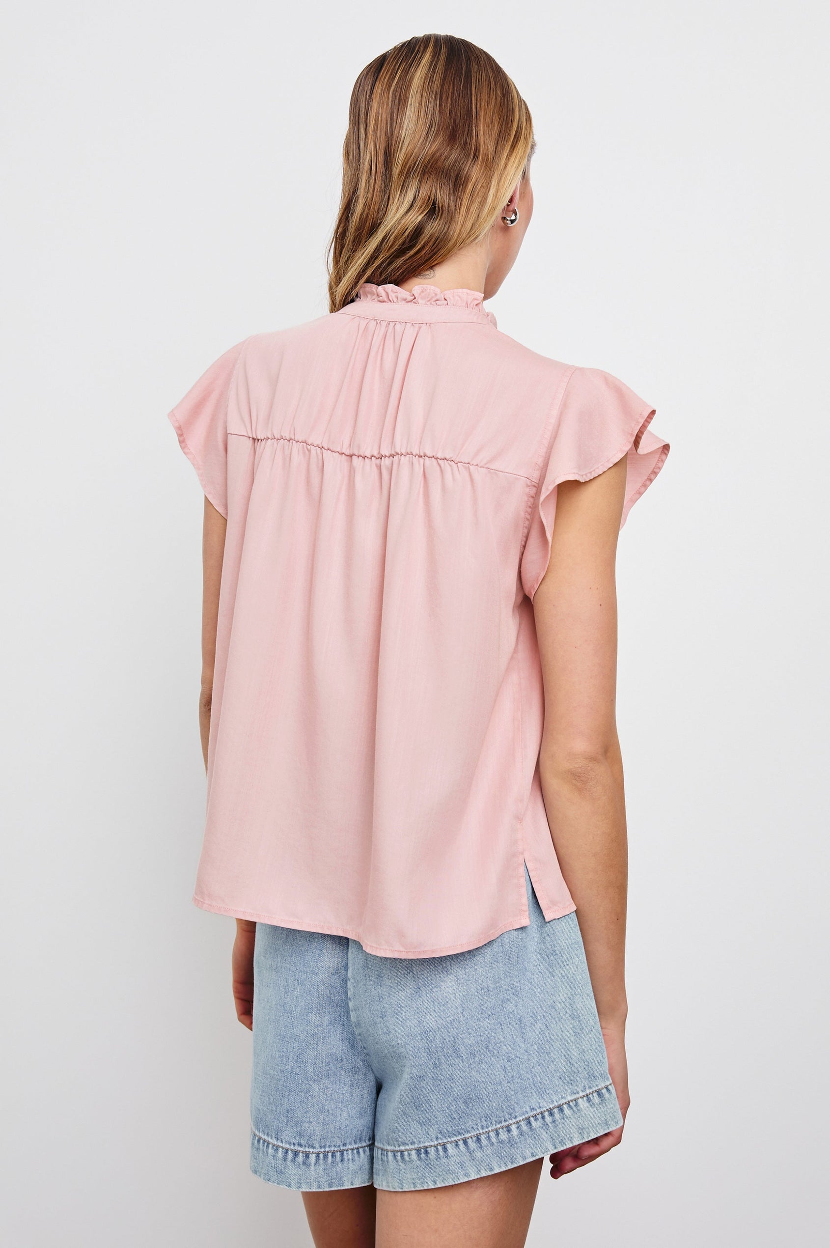 Ruthie Top with Flutter Cap Sleeves, a Ruffled Banded Collar, Buttons Down the Front, and Soft Shirring at Front Yoke in Dusty Rose Colorway - Back  View Featured on Model