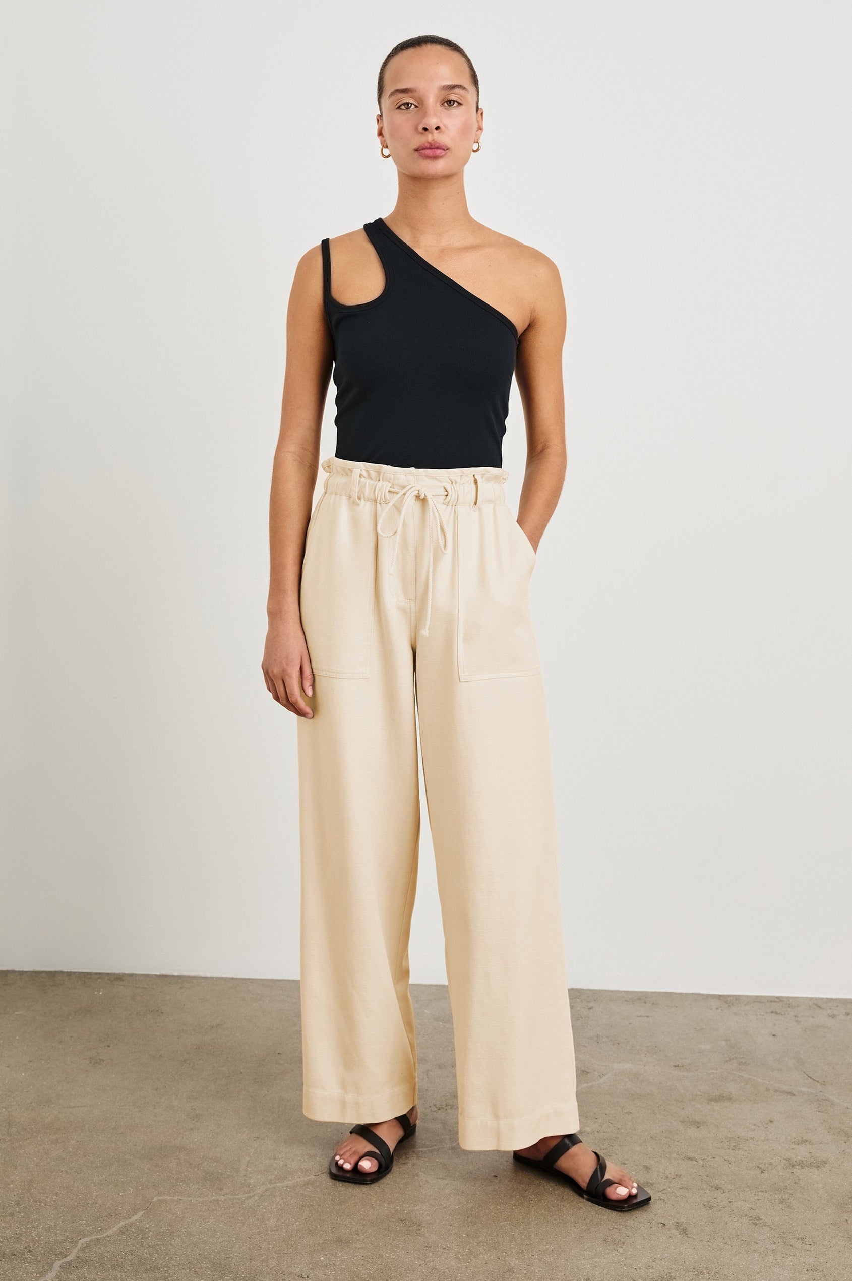 Ryan high rise linen pant with shirred waist and drawstring in Ecru - full body front view on model