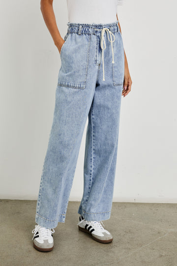 Ryan high rise linen pant with shirred waist and drawstring in light wash Faded Indigo- front view on model