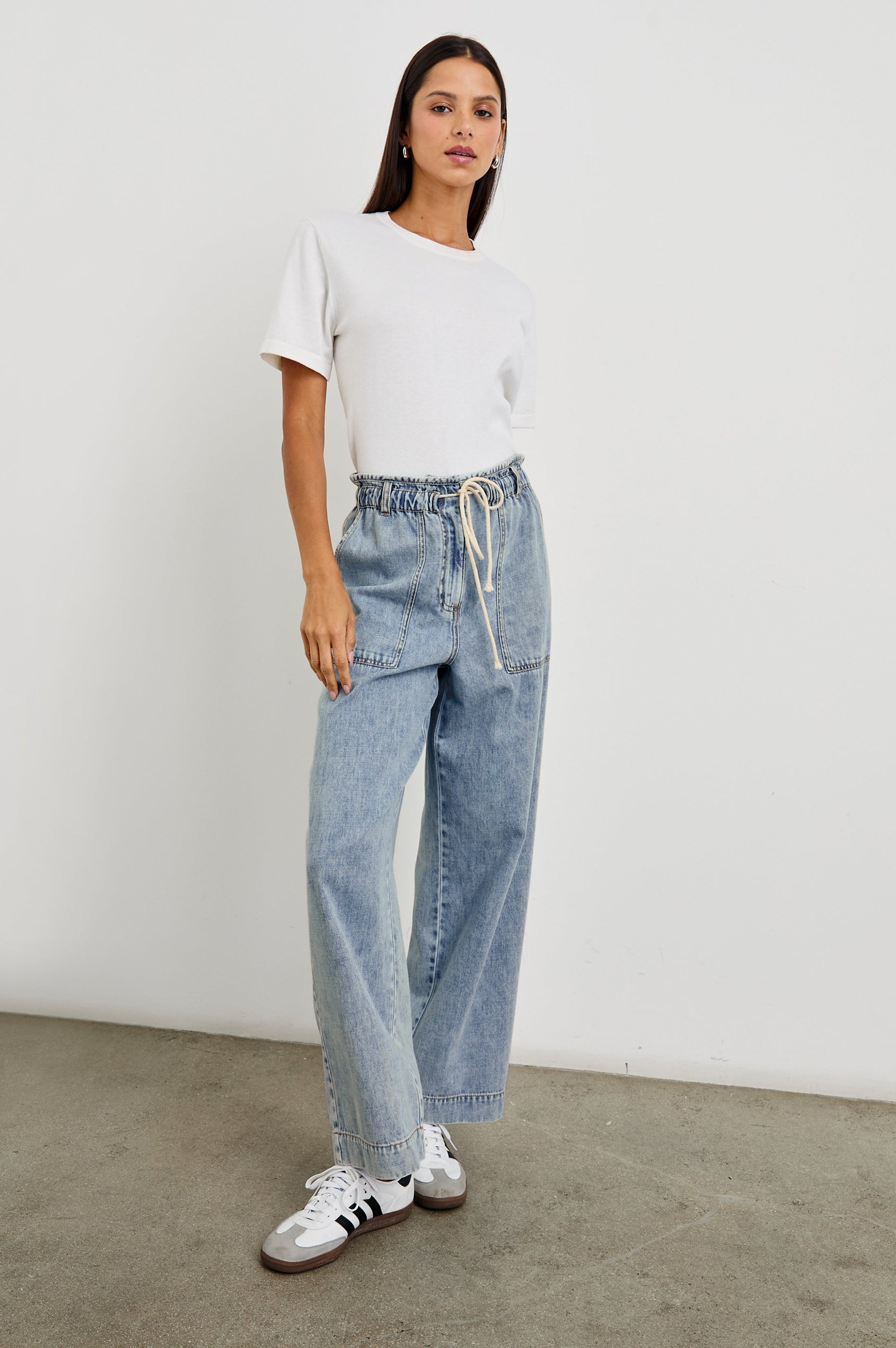 Ryan Pants with a Corded Drawstring Waist, Large Front Pockets and two Back Pockets in Faded Indigo Colorway - Front Full Body View Featured on Model