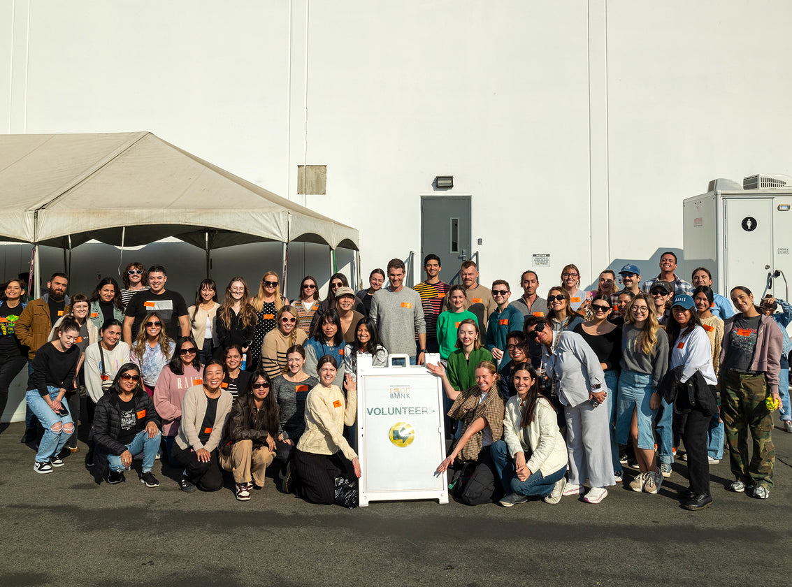 A GROUP OF EMPLOYEES AT A VOLUNTEER EVENT