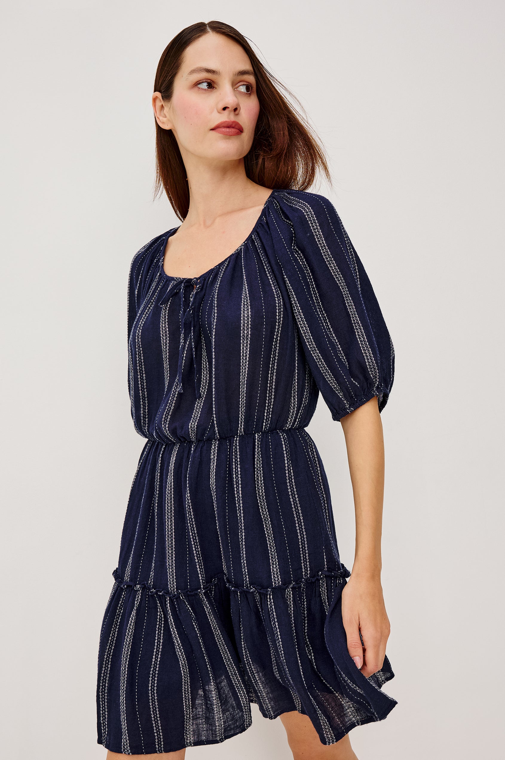Saba Linen Mini Dress With Scoop Neckline Center-Front Ties Elbow-Length Puff Sleeves in Marina Stripe Colorway - Full Body Front View Featured on Model