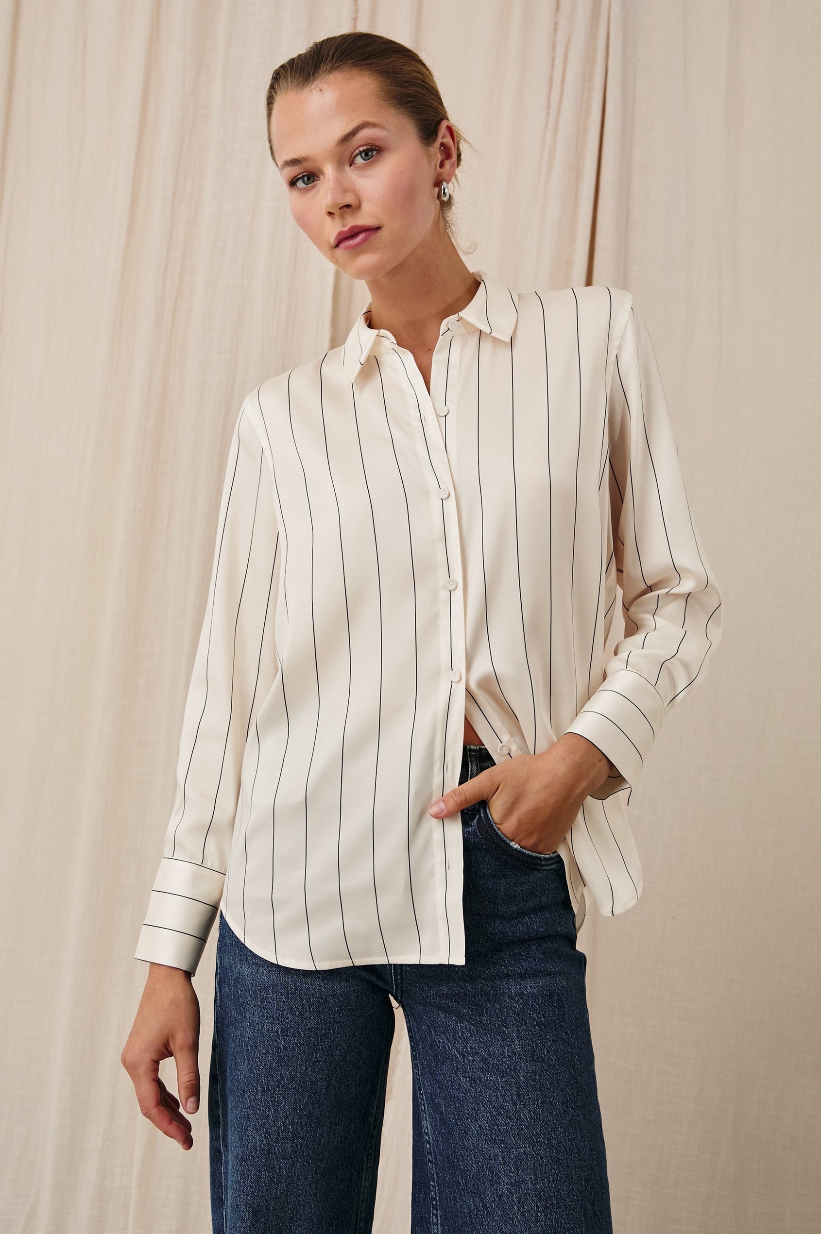 Saige Long-Sleeve Button Up in Brixton Stripe Colorway, Thin Black Stripes on Cream - Front View Featured on Model