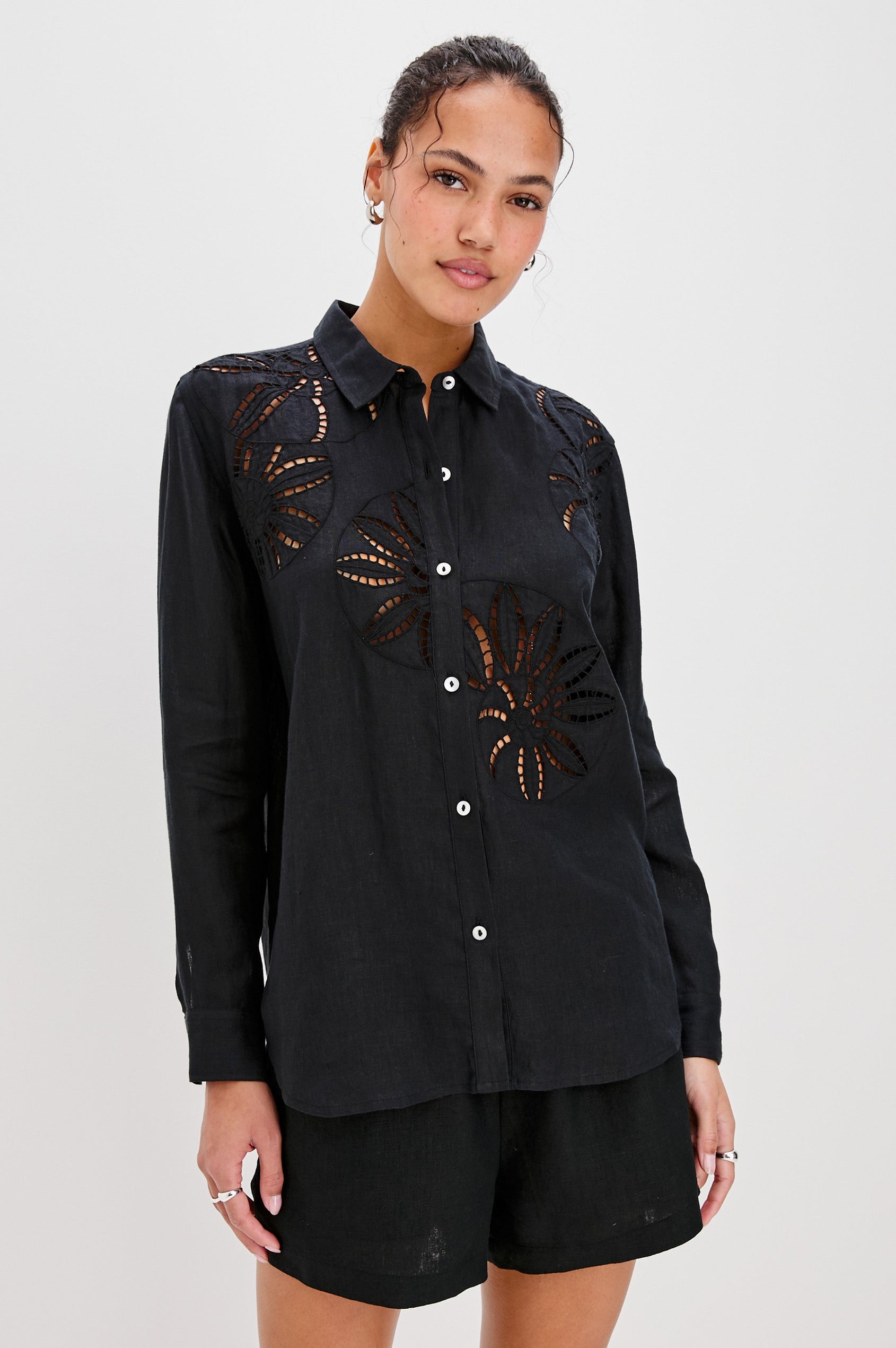 Samar Collared Button Front  Shirt with Long Sleeves and Floral Cutouts in Black Colorway. Front View Shown on Model.
