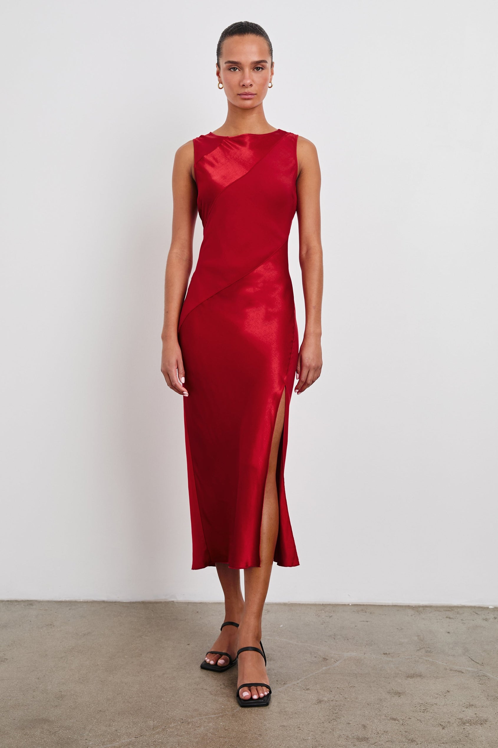 Sanya Sleeveless Midi Dress with a Crew Neck, Side Slit to the Upper Thigh, and Contrasting Matte Diagonal Panels in Scarlet Colorway - Front Full Body View Featured on Model