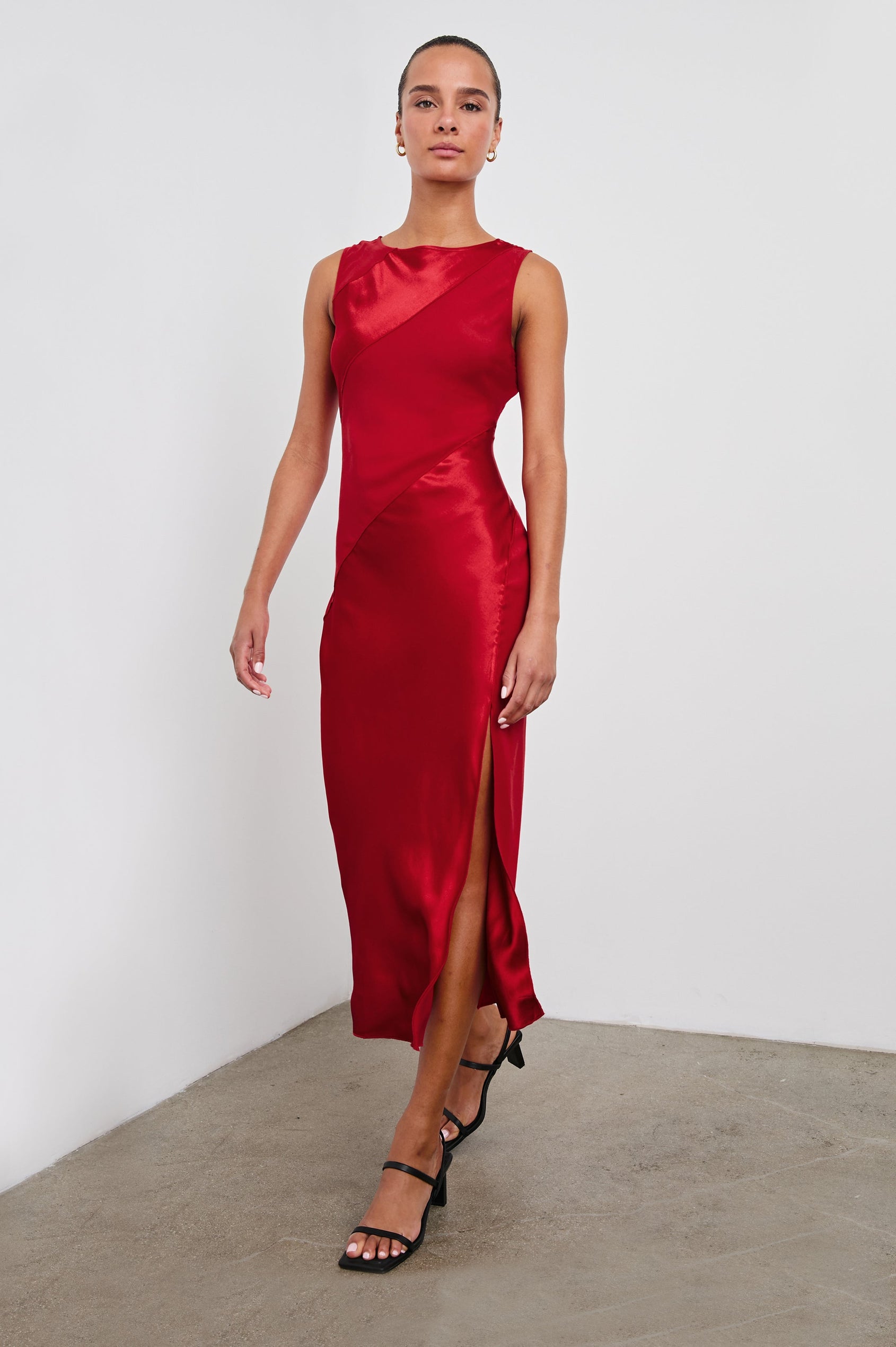 Sanya Sleeveless Midi Dress with a Crew Neck, Side Slit to the Upper Thigh, and Contrasting Matte Diagonal Panels in Scarlet Colorway - Front Full Body View Featured on Model