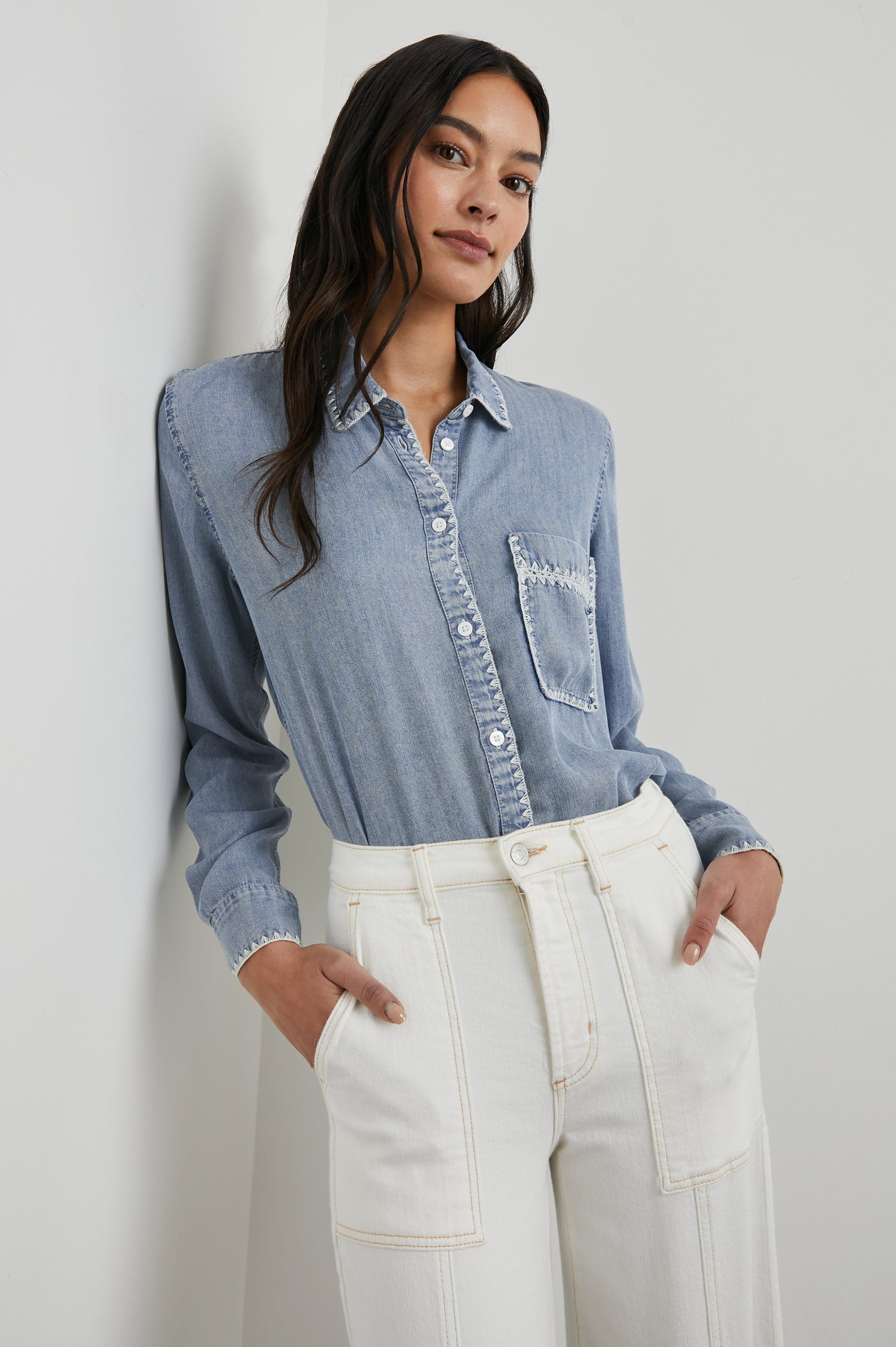 Saya Long-Sleeve, Button-Down Shirt with Collar, Buttoned Cuffs, Chest Patch Pocket, White Blanket Stich Trim in Medium Cloud Wash Colorway - Front tucked View Featured on Model