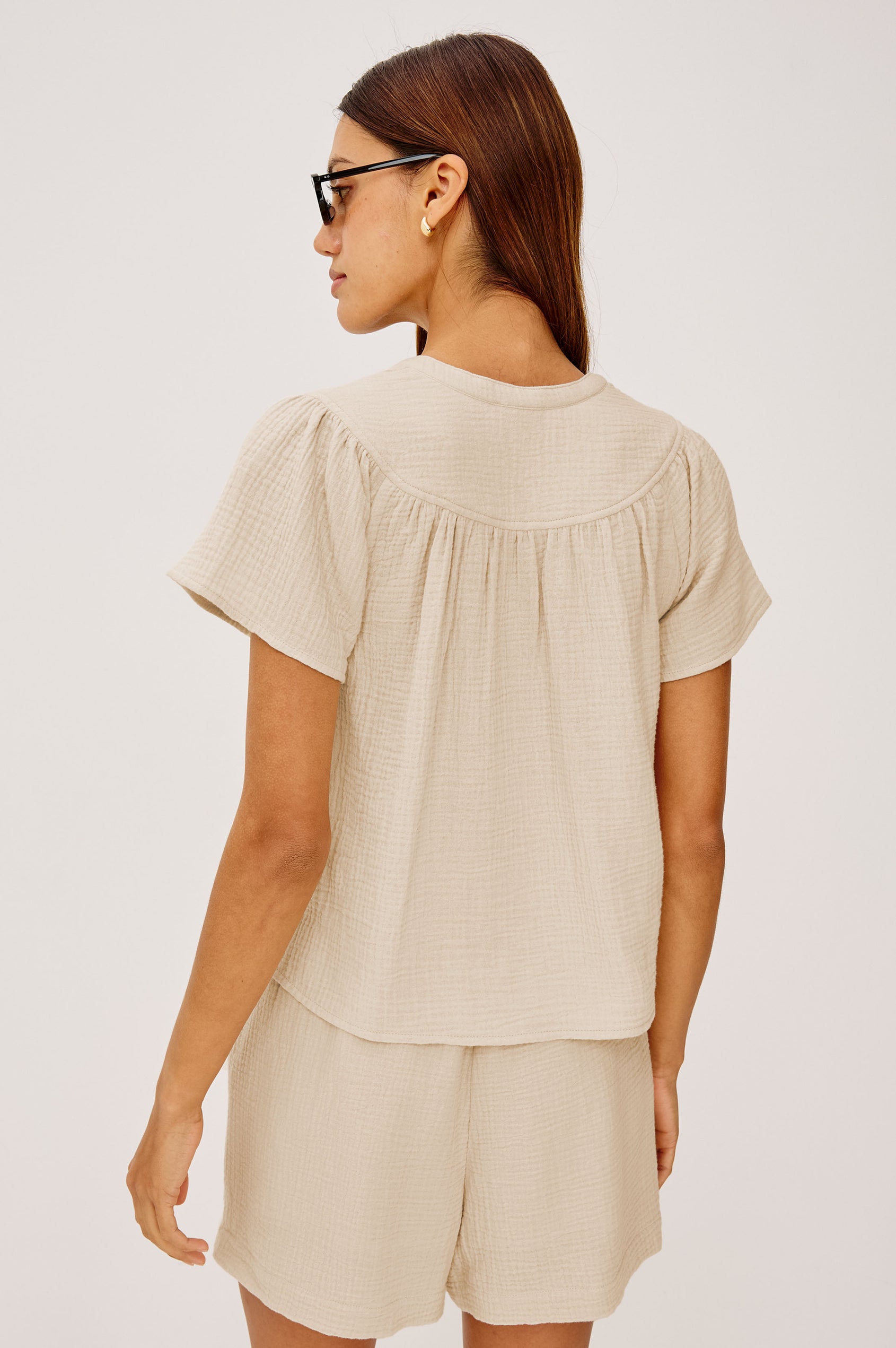 Sayer double cotton gauze flared short sleeve tee with V neckline in Flax - back view on model