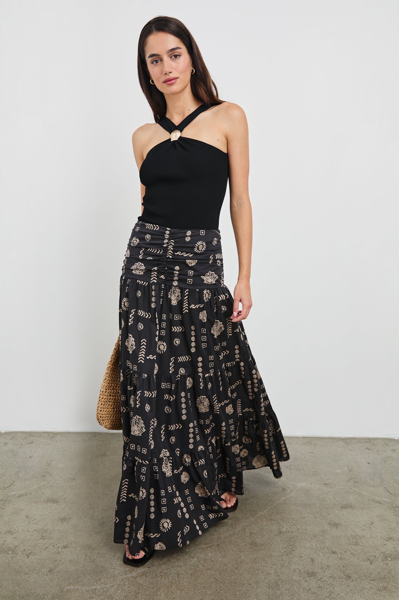 Senna Halter V-Front Tank Top with Gold Sea Shell Hardware at Center Front in Black Colorway. Full Body Front View Shown on Model.