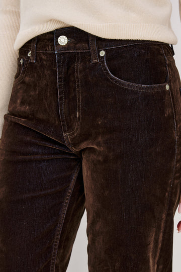 Sepulveda is a mid-rise 5-pocket, zip-front jean with a relaxed straight leg in chocolate-flocked denim in Chocolate Flocking colorway. Front detail view featured on model.