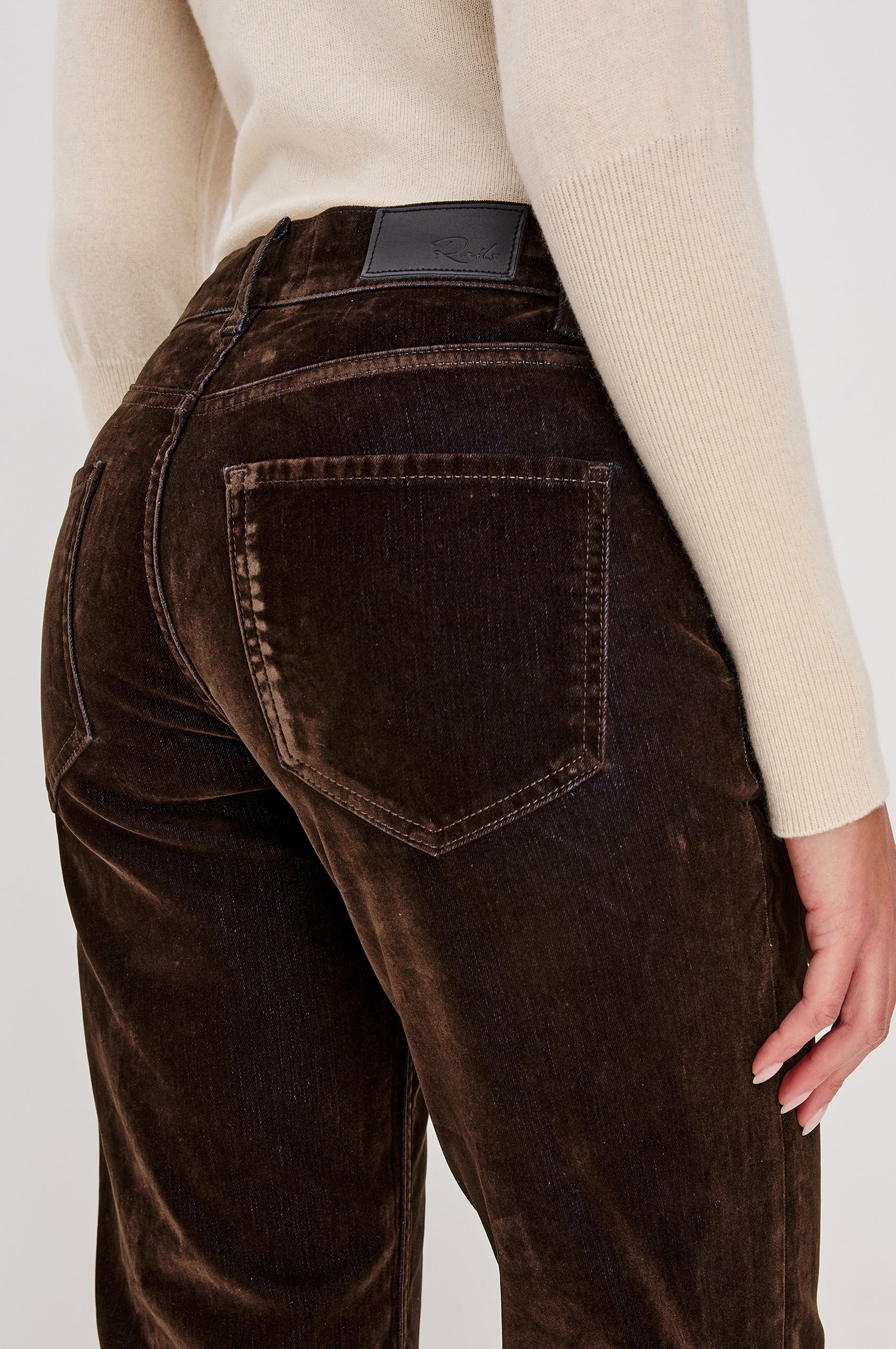 Sepulveda is a mid-rise 5-pocket, zip-front jean with a relaxed straight leg in chocolate-flocked denim in Chocolate Flocking colorway. Back detail view featured on model.