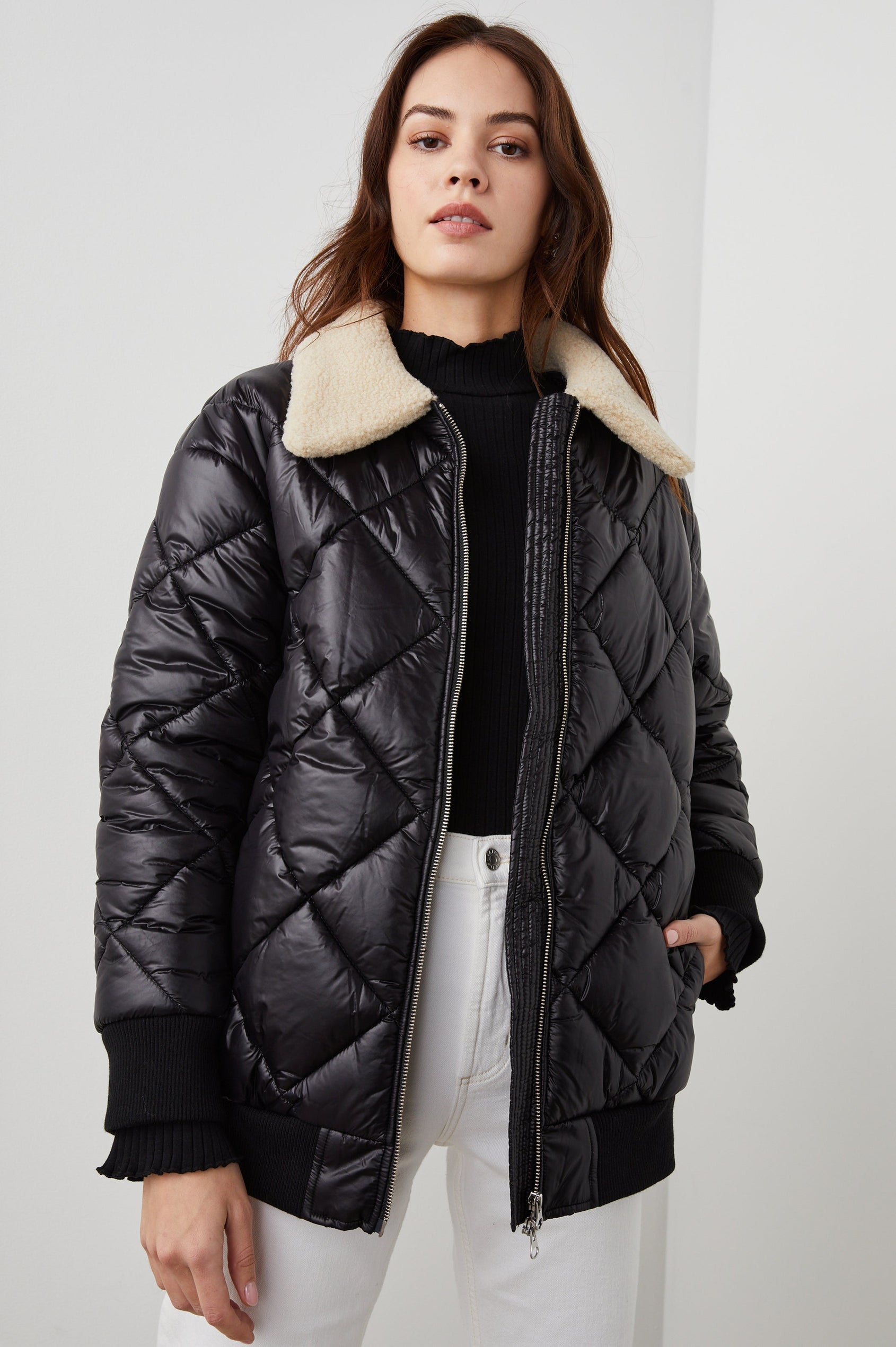 Shay Quilted Jacket with Zip Closure and a Cream Sherpa Collar in Black Colorway - Front View Featured on Model 