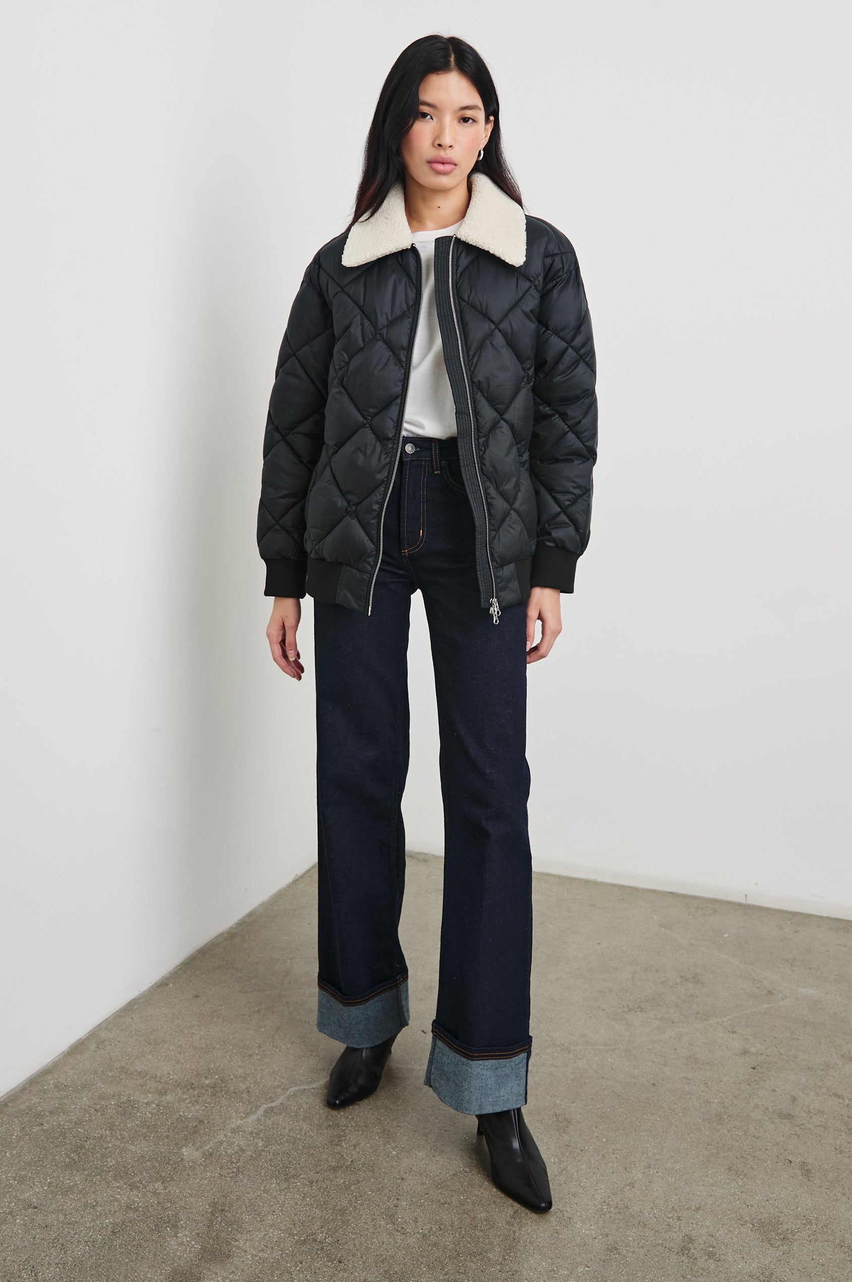 Shay Quilted Jacket with Zip Closure and a Cream Sherpa Collar in Black Colorway - Front Full Body View Featured on Model 