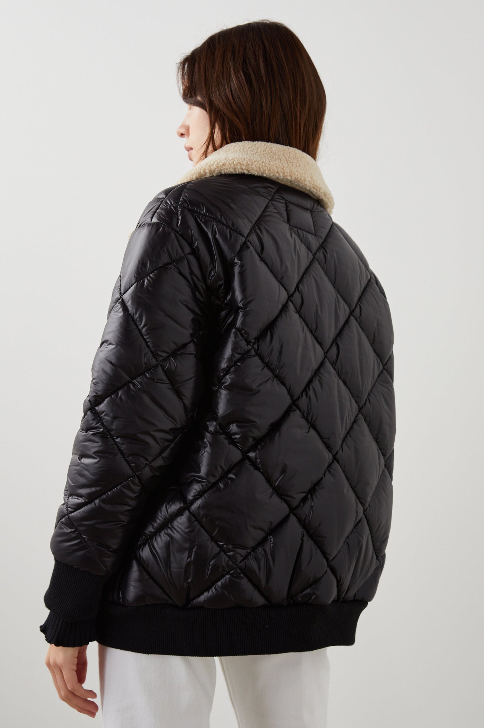 Shay Quilted Jacket with Zip Closure and a Cream Sherpa Collar in Black Colorway - Back View Featured on Model 