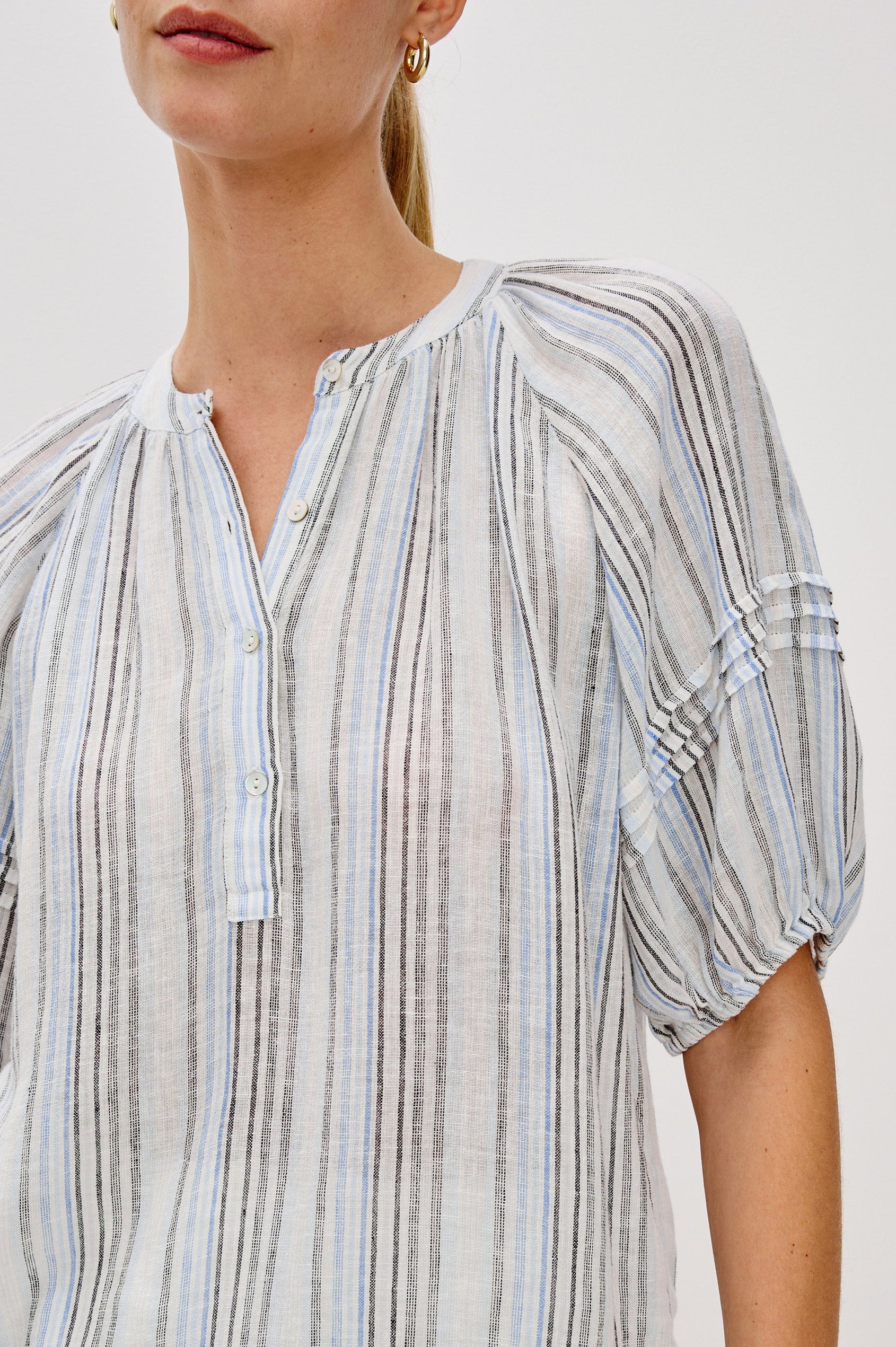 Shoshanna Pull Over Button Front Blouse with Elbow Length Raglan Blouson Sleeves in Antibes Stripe. Front Detail View Shown on Model.