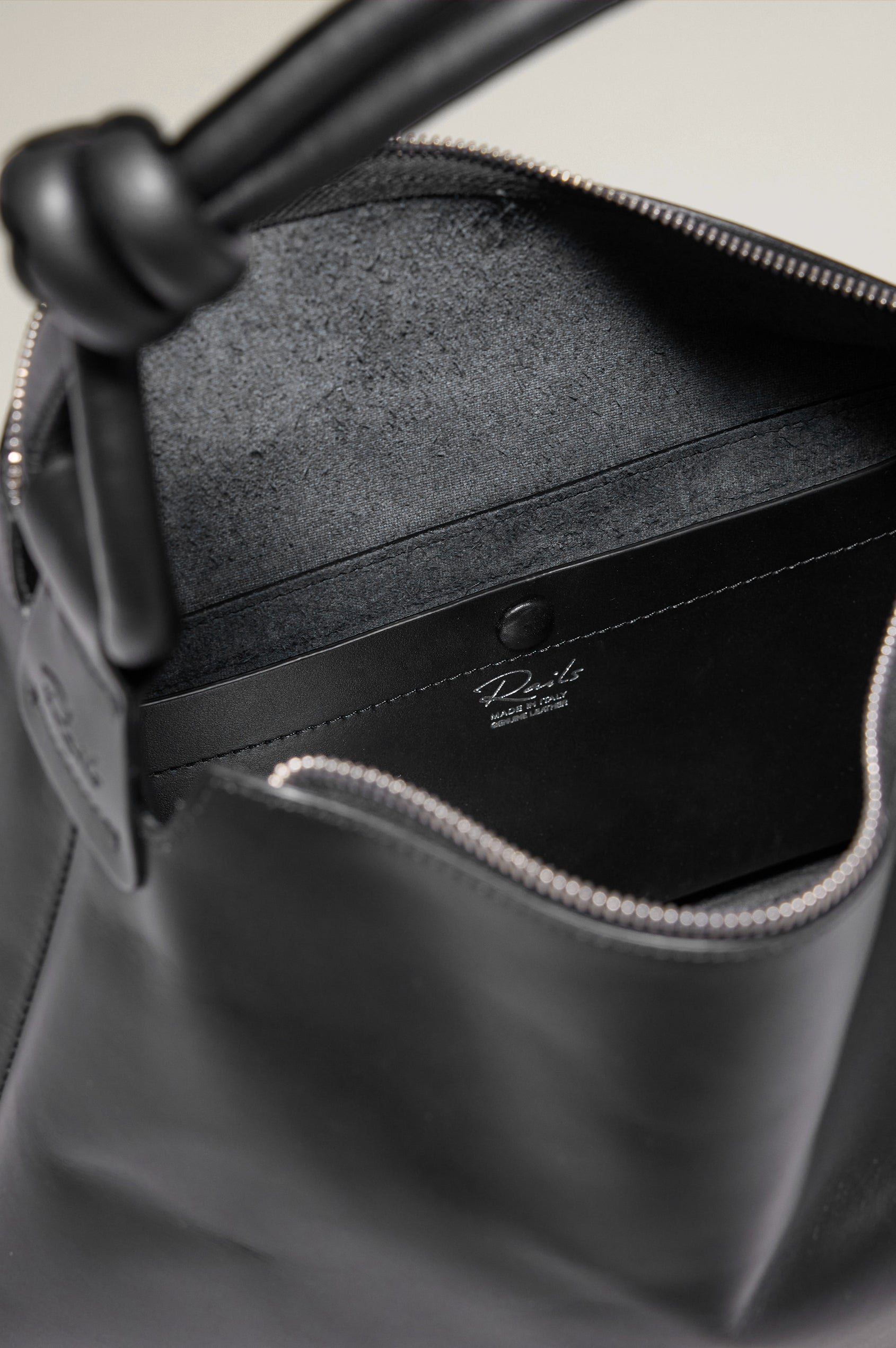 Siena Slouchy Hobo Bag in Italian Leather With Knotted Top Strap, Zipper Closure With Fringe Tassel And Interior Snap Button Slip Pocket in Black Colorway - Top Interior View Featured