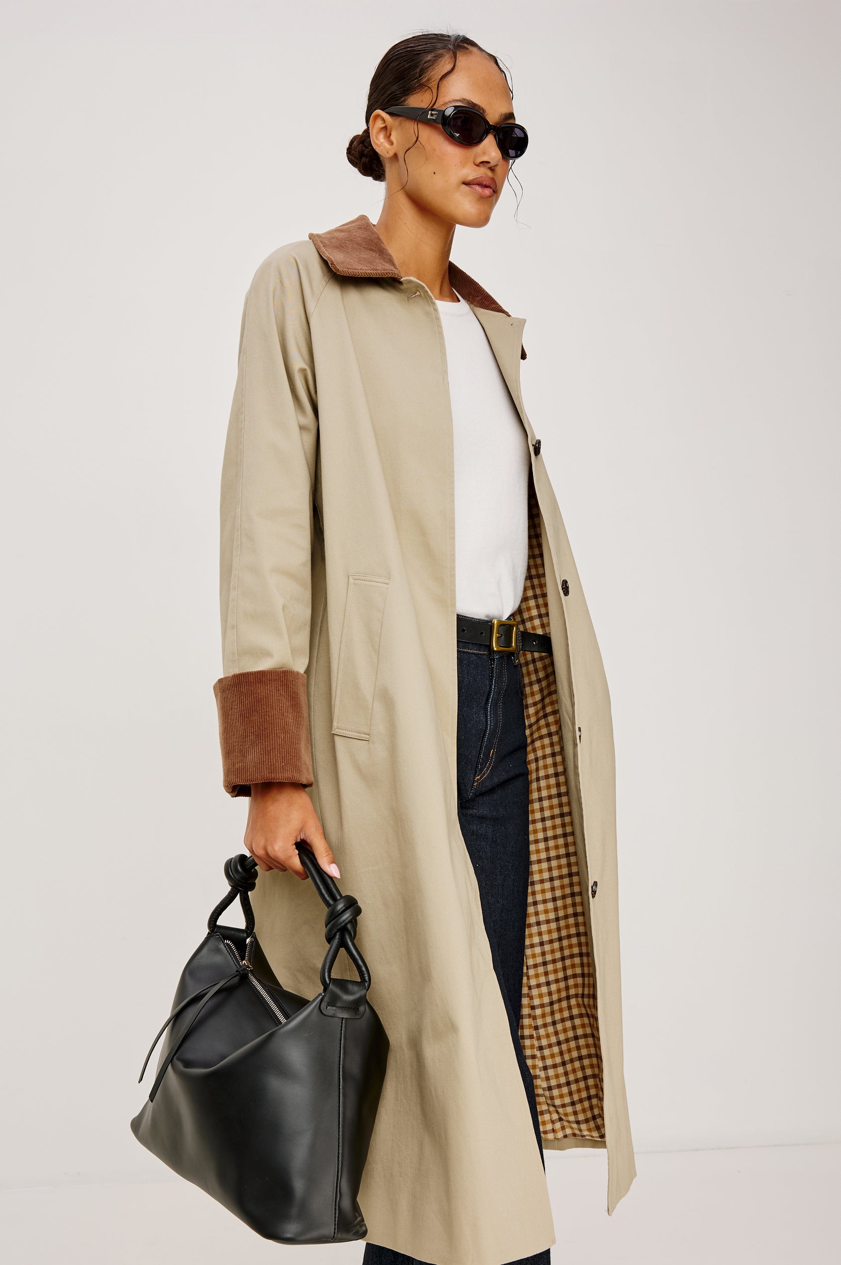 Siena Slouchy Hobo Bag in Italian Leather With Knotted Top Strap, Zipper Closure With Fringe Tassel And Interior Snap Button Slip Pocket in Black Colorway - Stylized on Model Featured