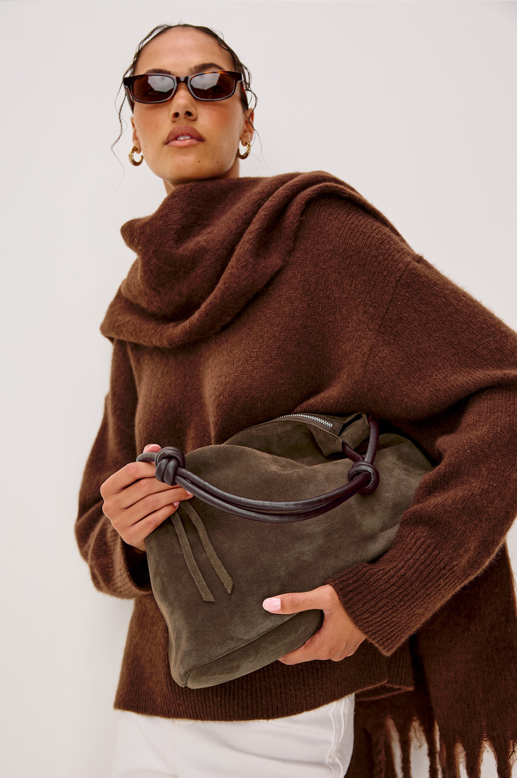 Siena Slouchy Hobo Bag in Suede With Knotted Top Strap, Zipper Closure With Fringe Tassel And Interior Snap Button Slip Pocket in Espresso Suede Colorway - Stylized on Model Featured