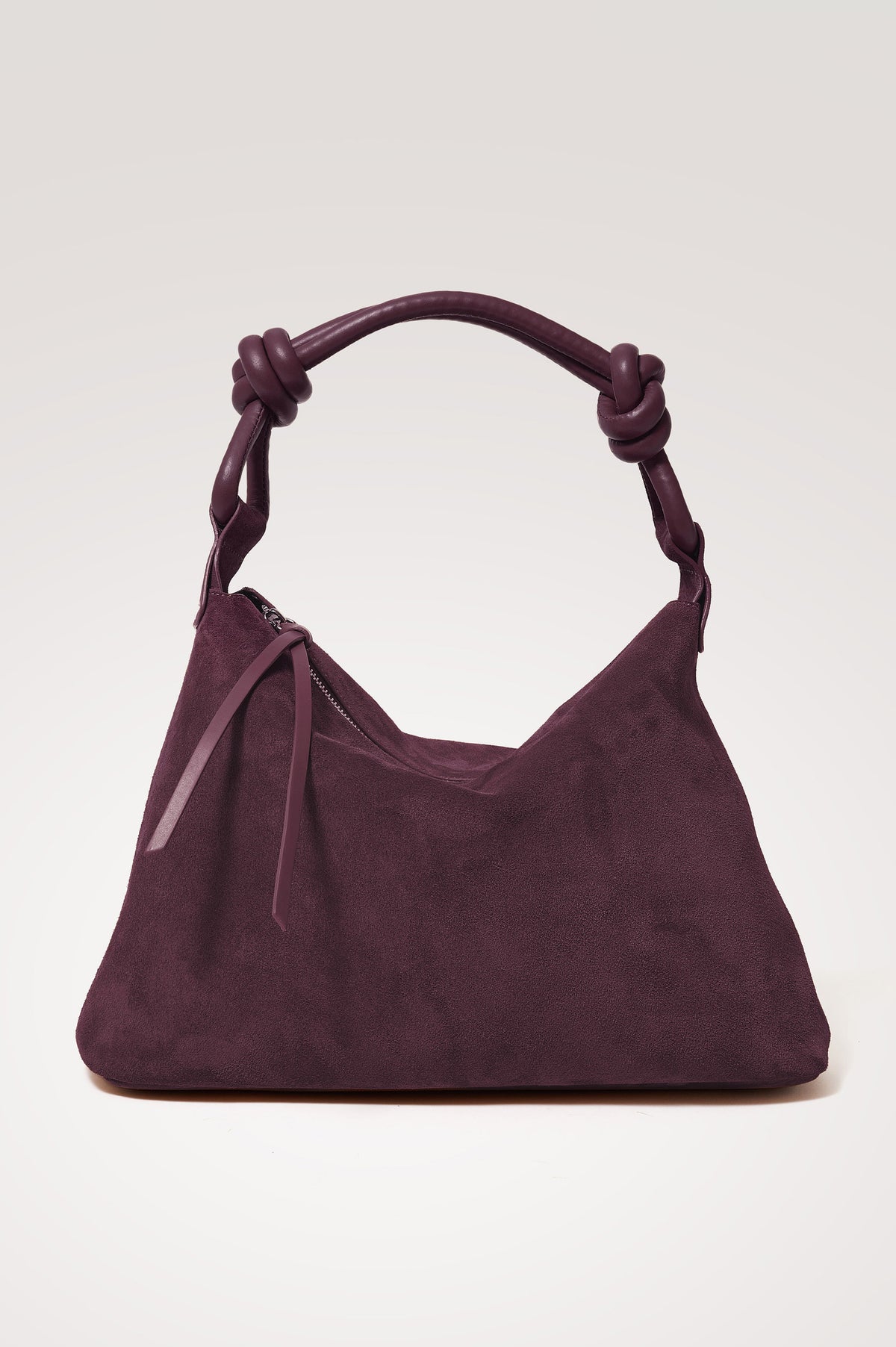Siena Hobo Bag in Suede With Knotted Top Strap, Zip Closure With Fringe Tassel Pull, Microsuede Lining, Snap-Button Slip Pocket and Foil Logo Stamp at Interior in Plum Suede Colorway -