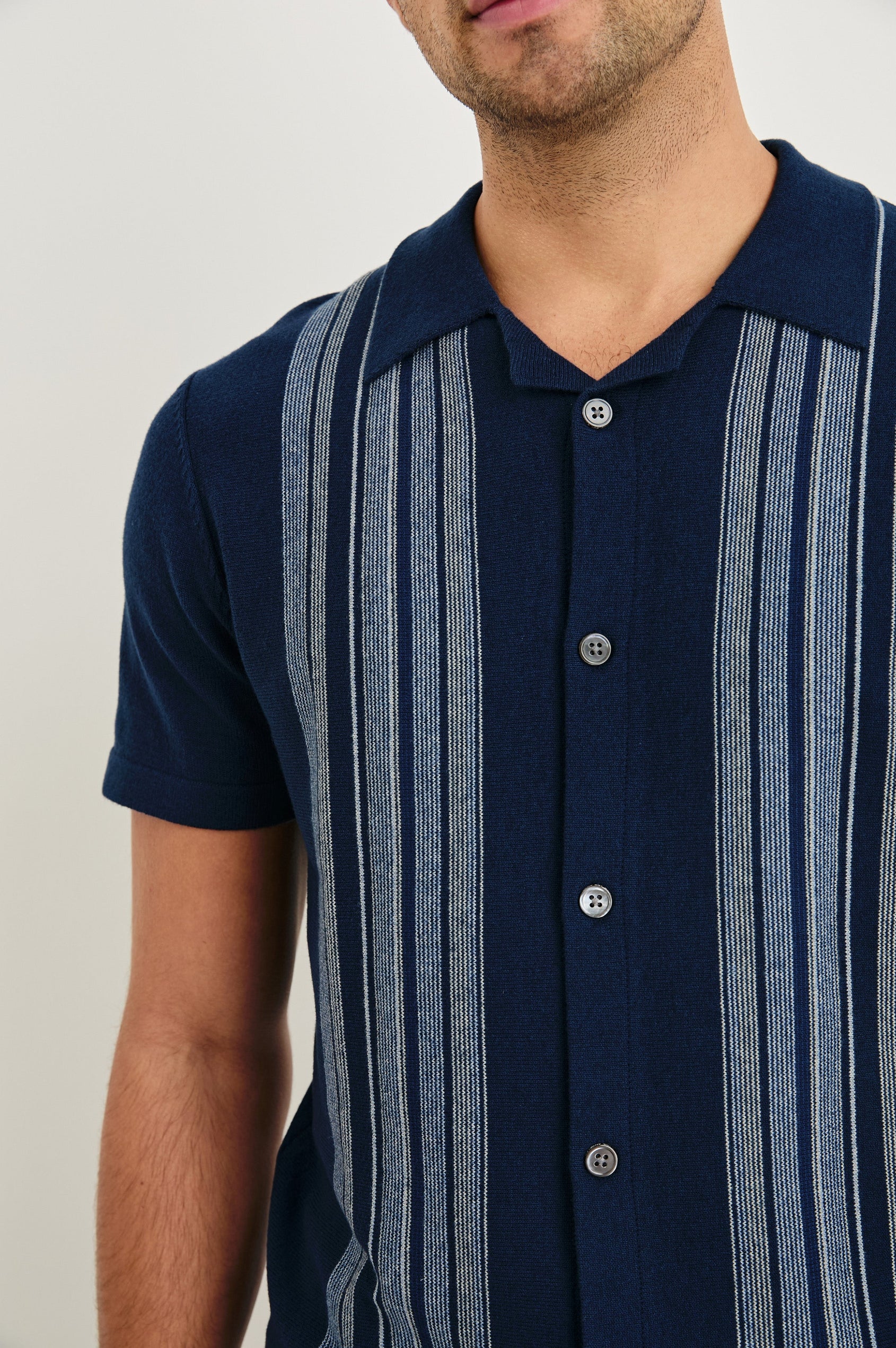 Silas short sleeve knit button down shirt with retro front striped design features in Blue Heather Multi - close up of details on model