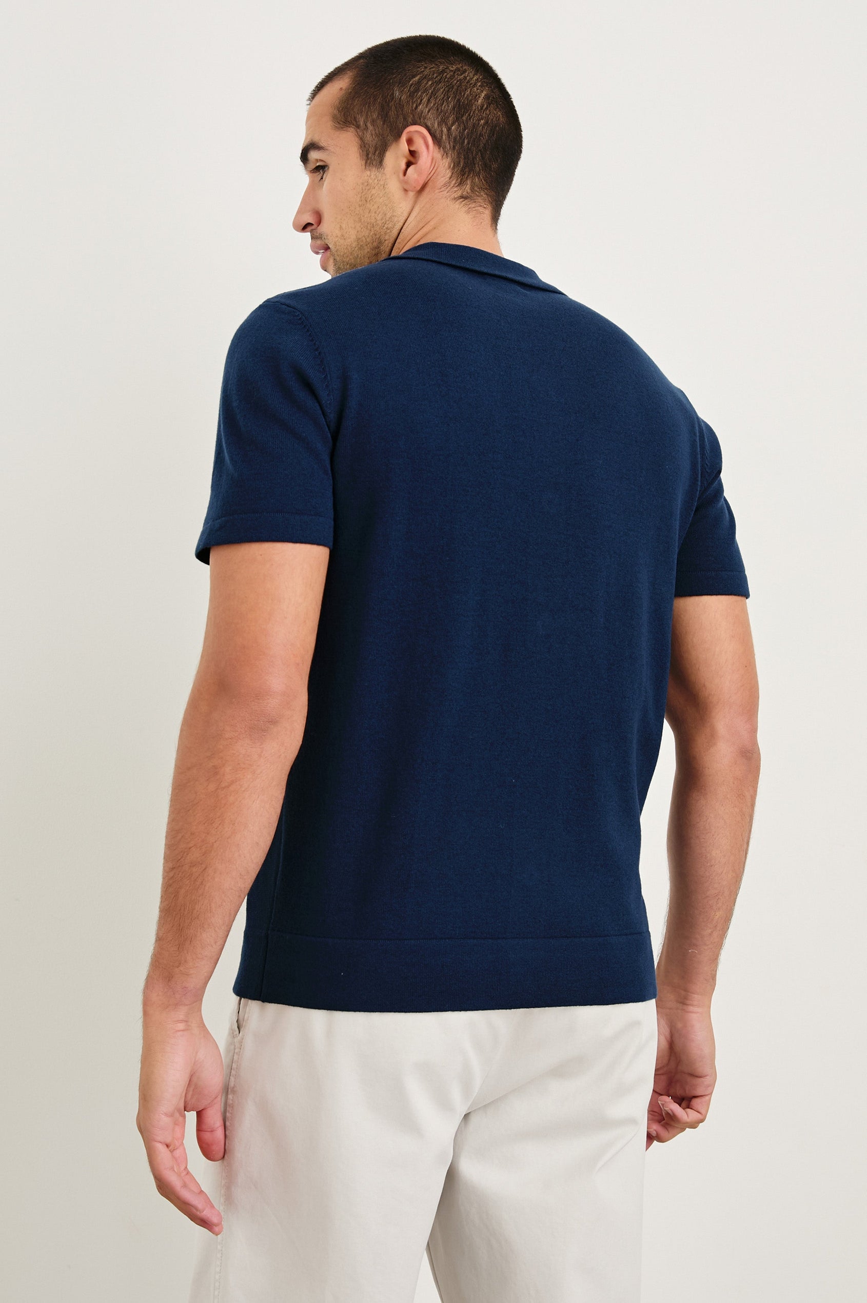 Silas short sleeve knit button down shirt with retro front striped design features in Blue Heather Multi - back view on model