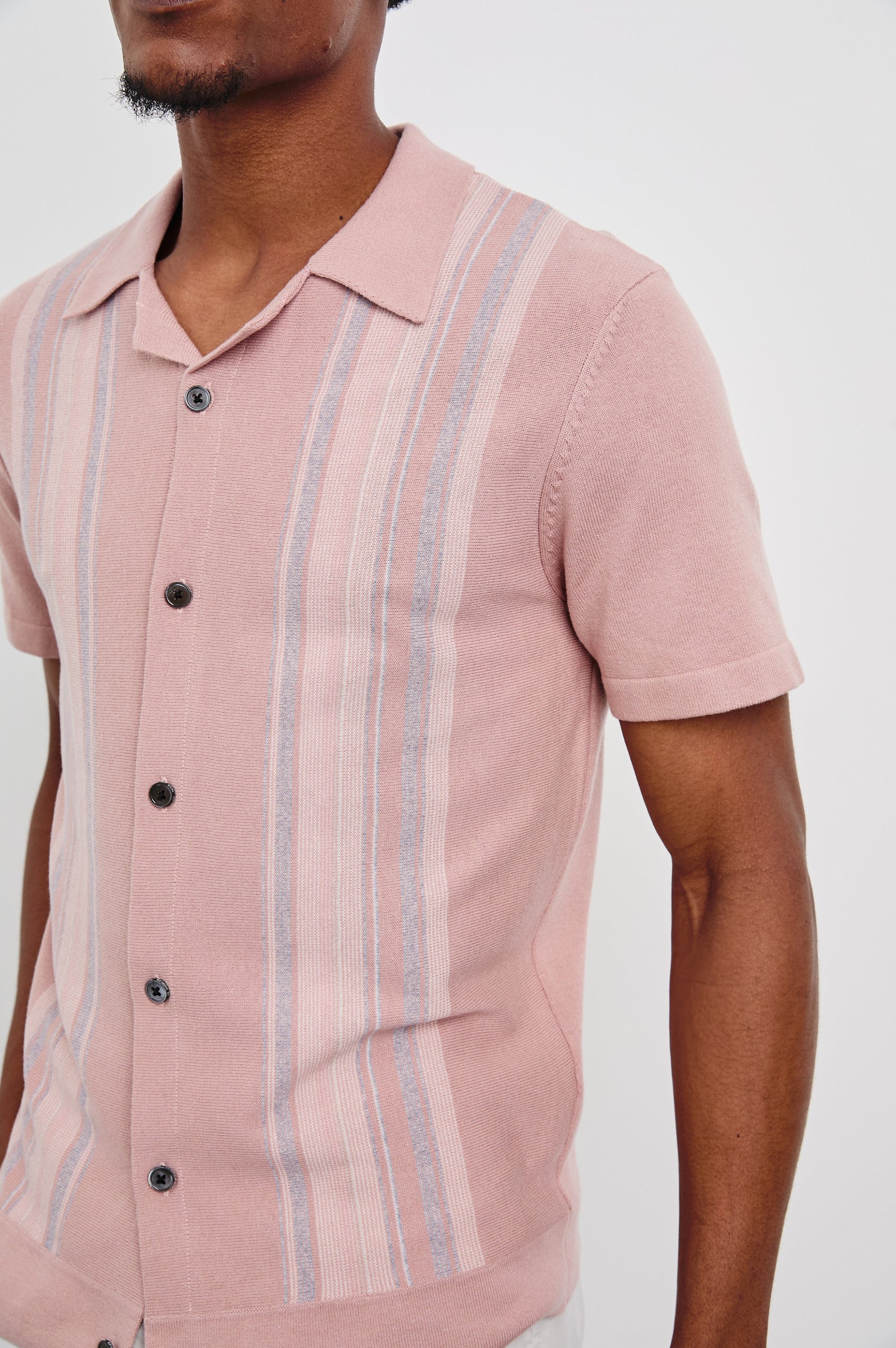Silas Short-Sleeve Button Up in Rose Multi Colorway, with two front sections of vertical stripes in pinks, creams, and blues - Front View Featured on Model