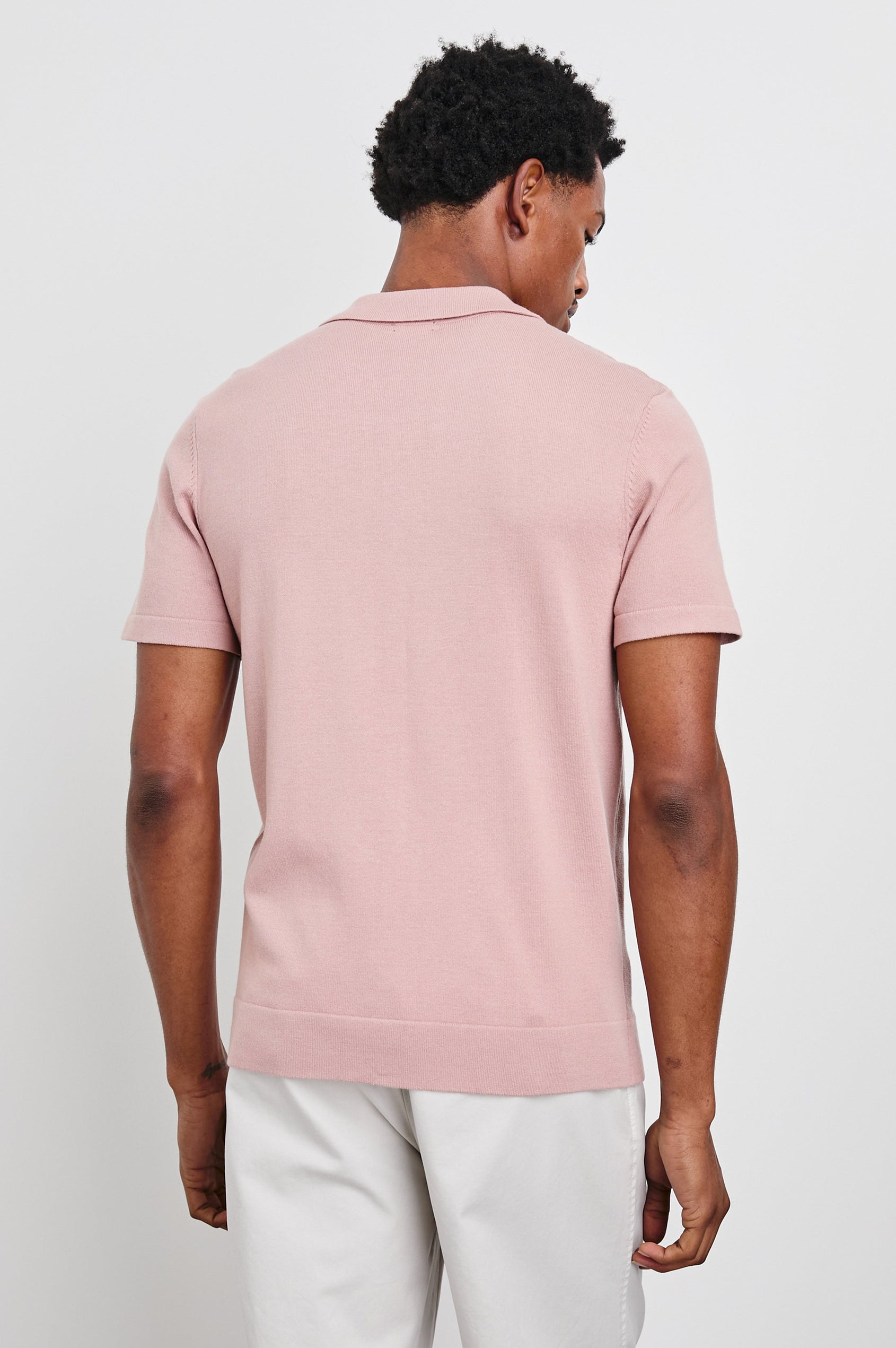 Silas Short-Sleeve Button Up in Rose Multi Colorway, with two front sections of vertical stripes in pinks, creams, and blues - Back View Featured on Model