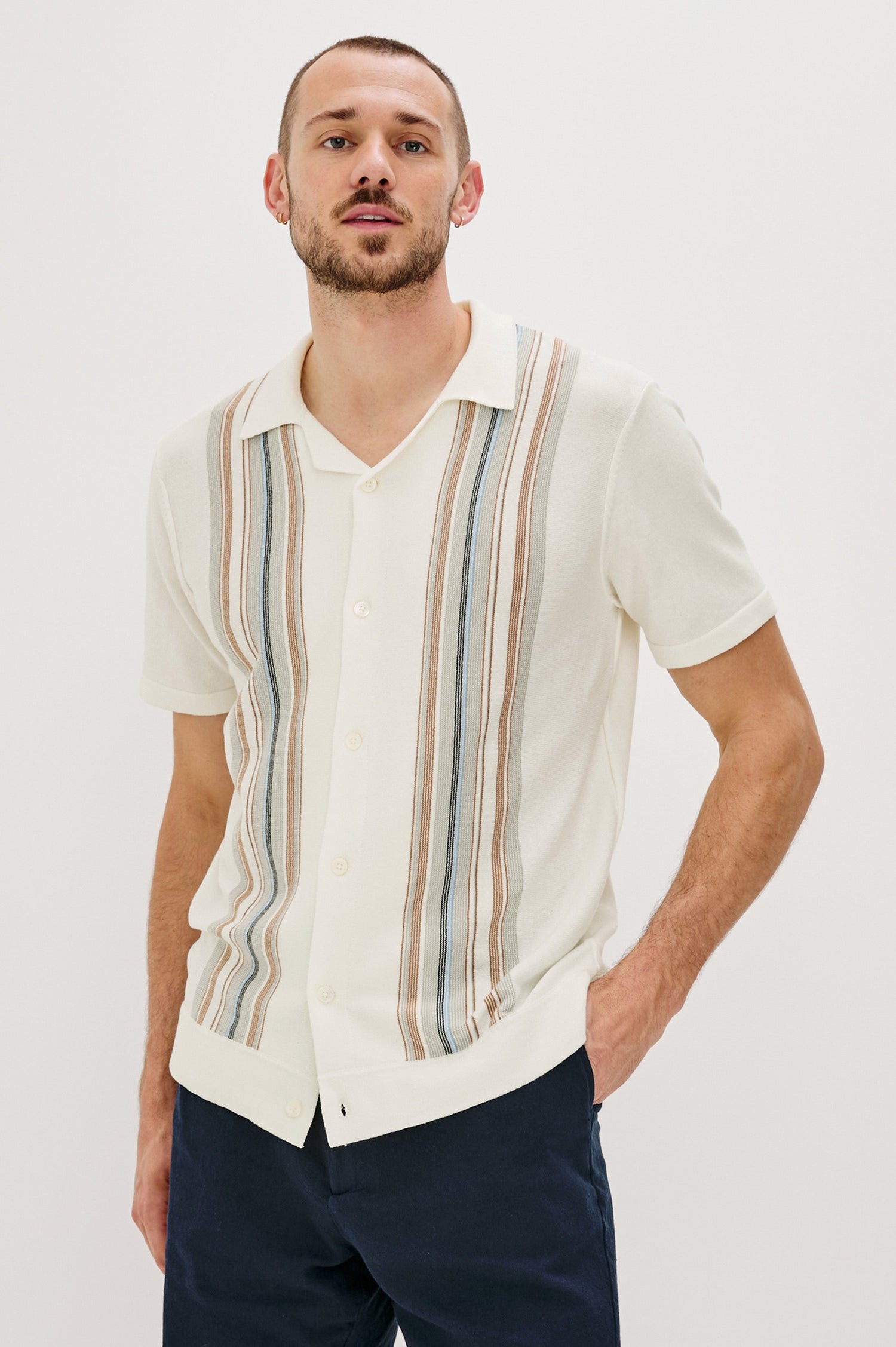 Silas Short-Sleeve Button Up in White Multi Colorway, with two front sections of vertical stripes in Blues, brown and grey - Front View Featured on Model