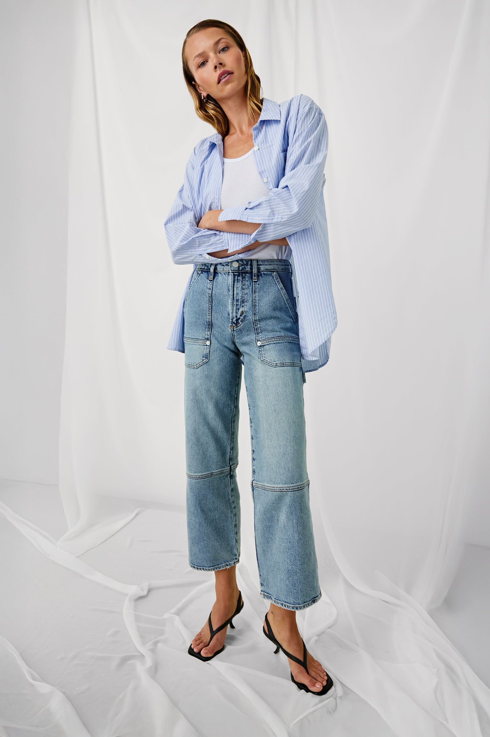 Silverado high rise wide leg crop pant with carpenter style details and contrast stitching in Blueprint - stylized full body front view on model with arms crossed