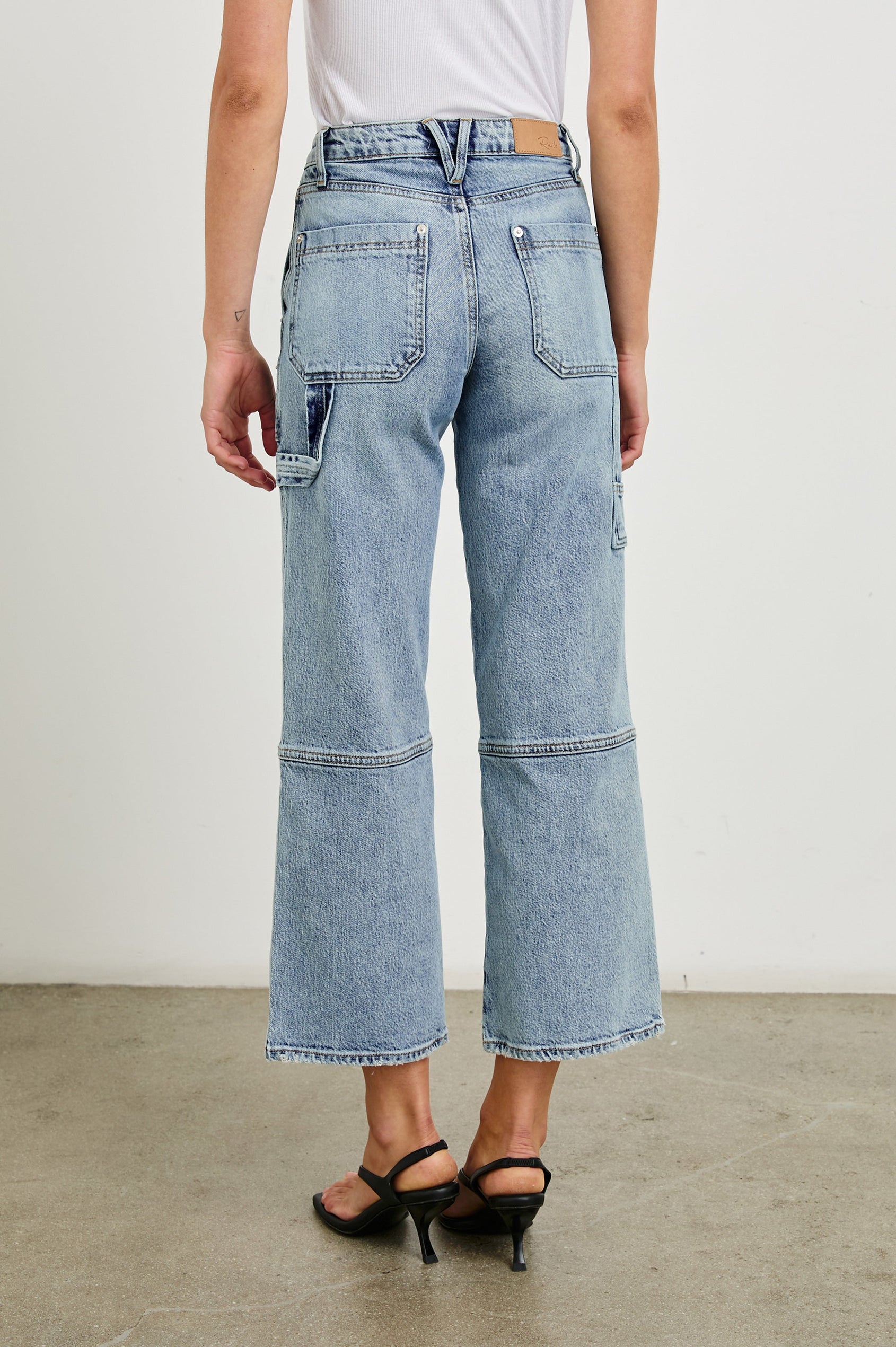 Silverado high rise wide leg crop pant with carpenter style details and contrast stitching in Blueprint - back view on model