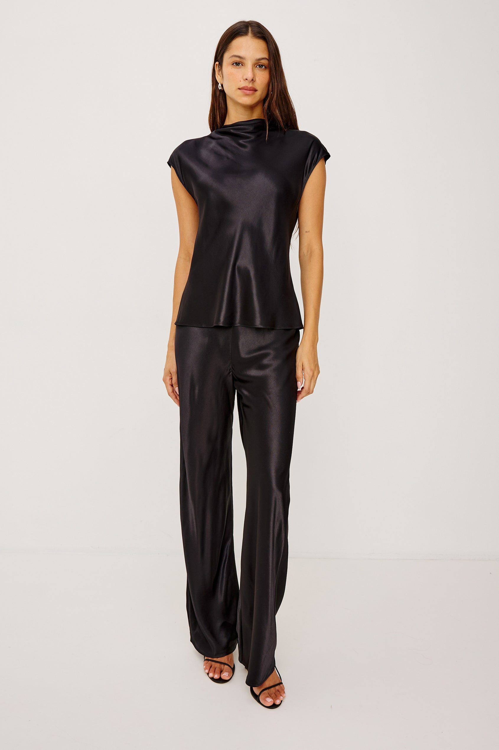 Silvi High-Waisted Pant in Metallic Satin Back Crepe With Elastic Waistband and Straight Legs in Black Colorway - Full Body Front View Featured on Model