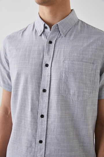 Fairfax Short-Sleeve Button Up with a Chest Patch Pocket in Iron Gate Colorway - Front View Featured on Model